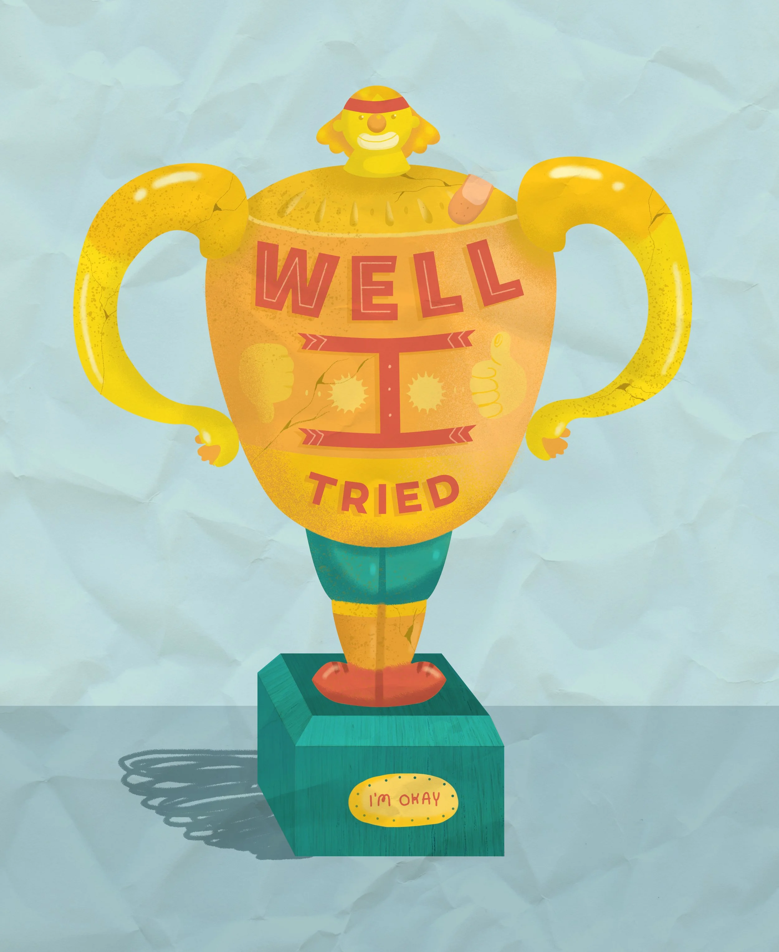 Colorful cartoon-style trophy with a smiling character on top, muscular arms, and a body made of a large cup labeled 'WELL TRIED'. The base says 'I'M OKAY'. The background is crumpled paper.
