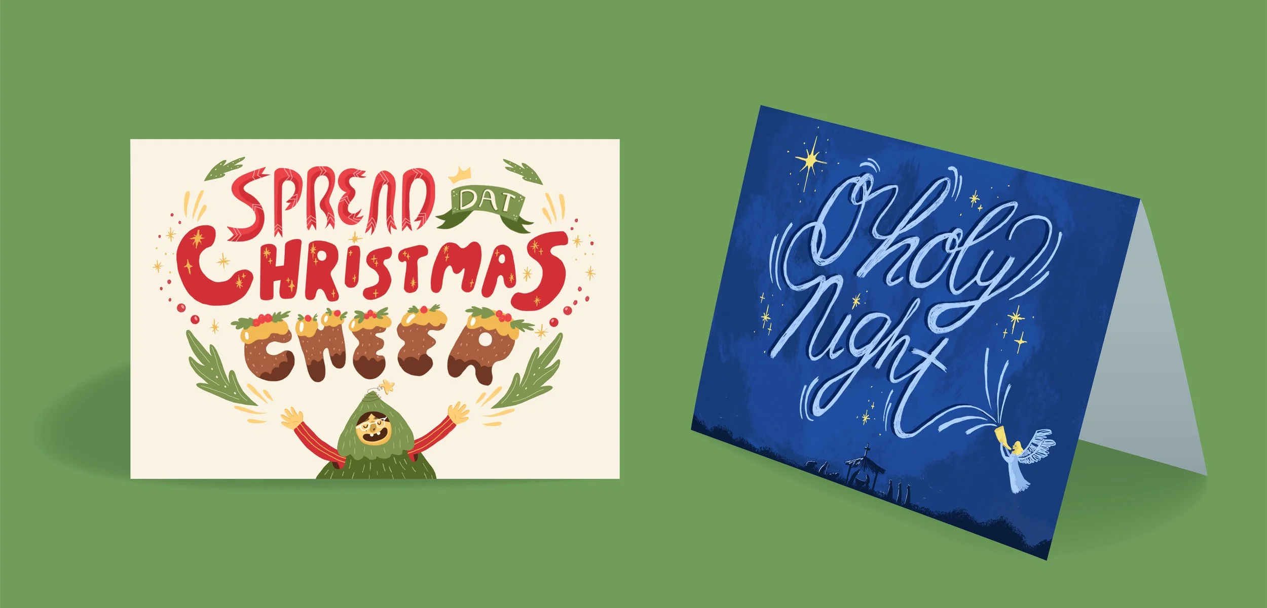 Two folded Christmas greeting cards on a green surface. The left card has a festive design with the text 'Spread dat Christmas cheer,' a smiling character, and holiday decorations. The right card says 'O Holy Night' in elegant script with stars and a