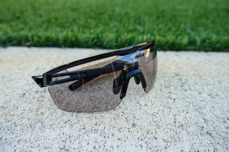 The Avenger model shown here in black, with the photochromic lens in a light tint amidst the afternoon shade.