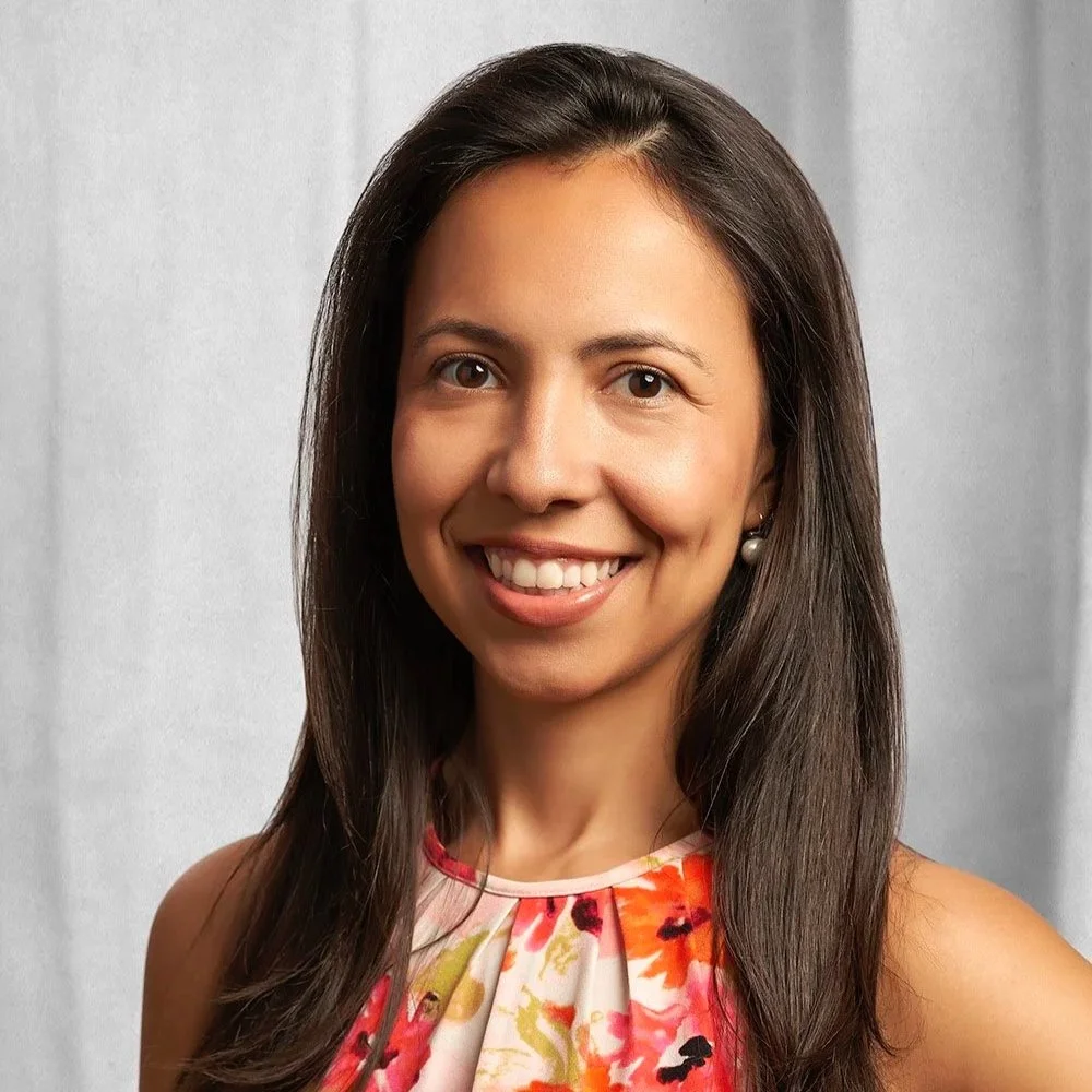 Portrait of Juliana Mattos, Director of Creative Production at YtC Creative photographed in a studio environment against a soft draping background