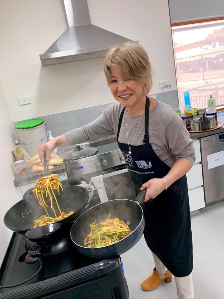 Woking up a noodle box at The Basin Community House Meet, Greet and Eat Volunteers lunch