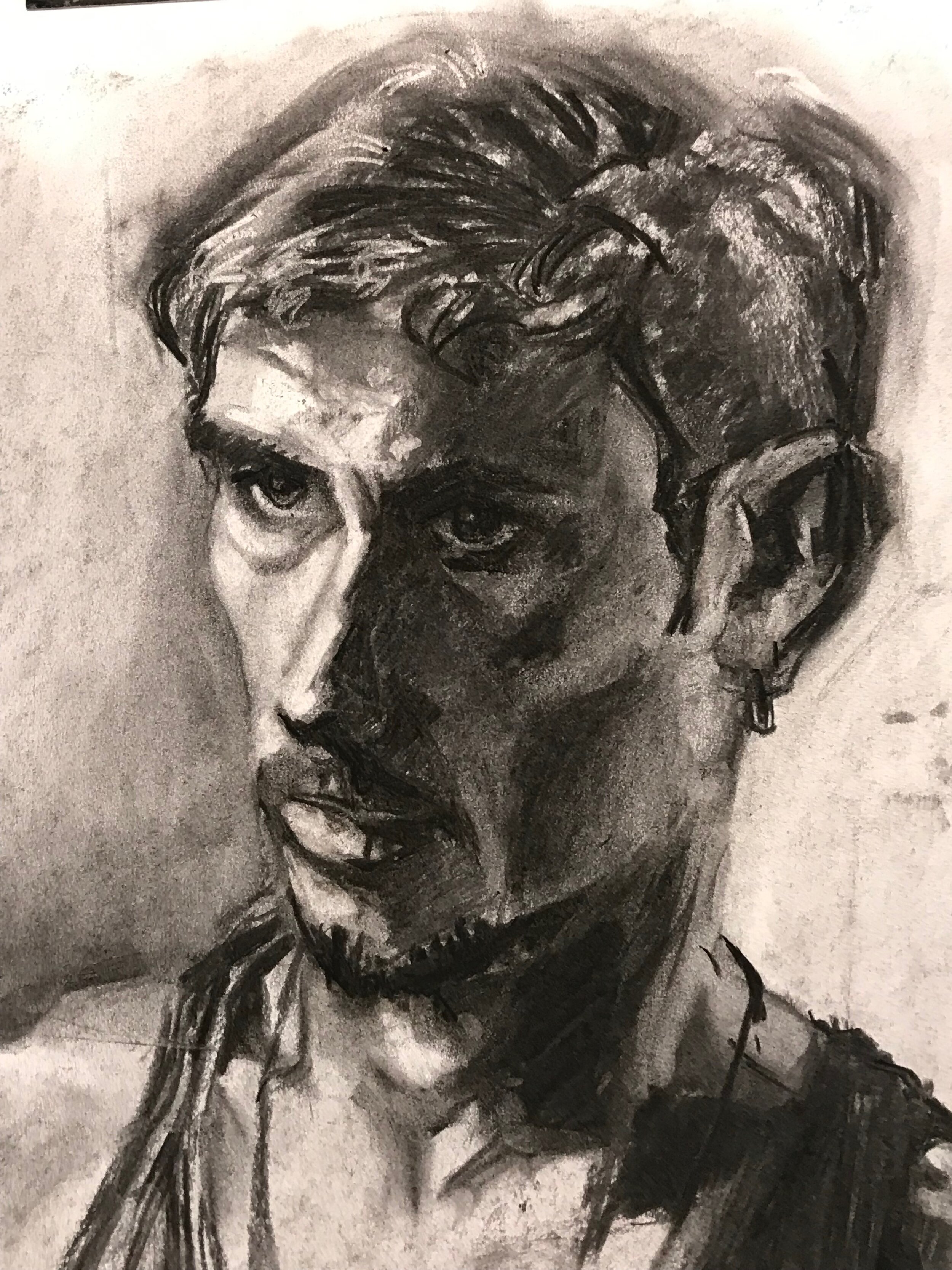 Charcoal on paper of male model.