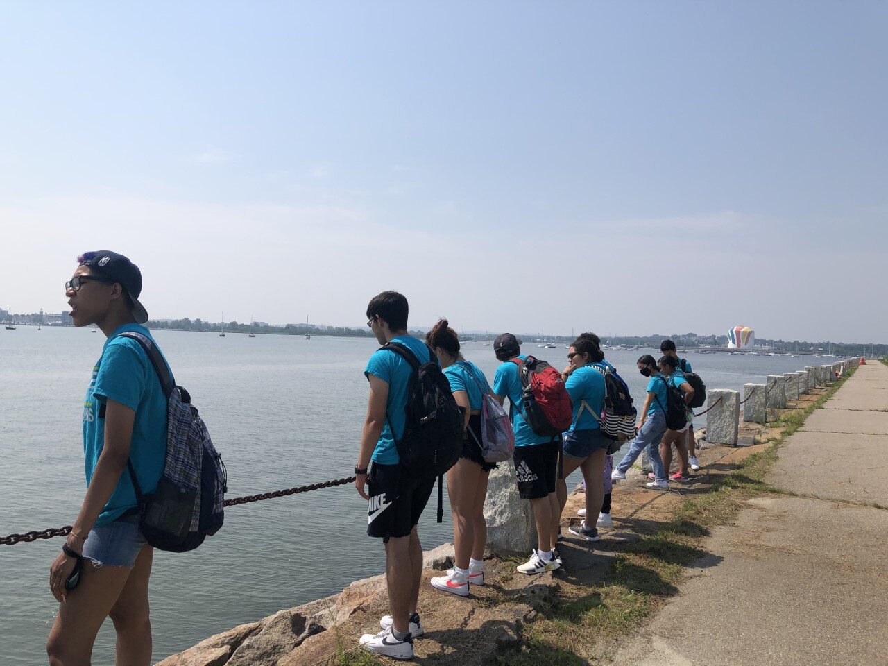  This image of the Waterfront Ambassadors was taken at UMass Boston on our tour with Patricio. We learned about how climate change and environmental justice are connected to many other issues like poverty. -Priya 