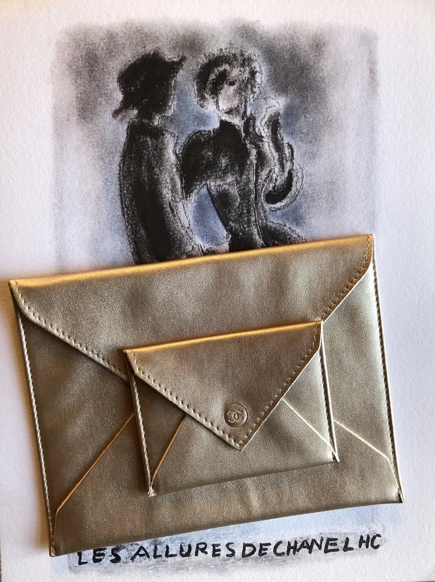 Chanel gold envelope pouches
