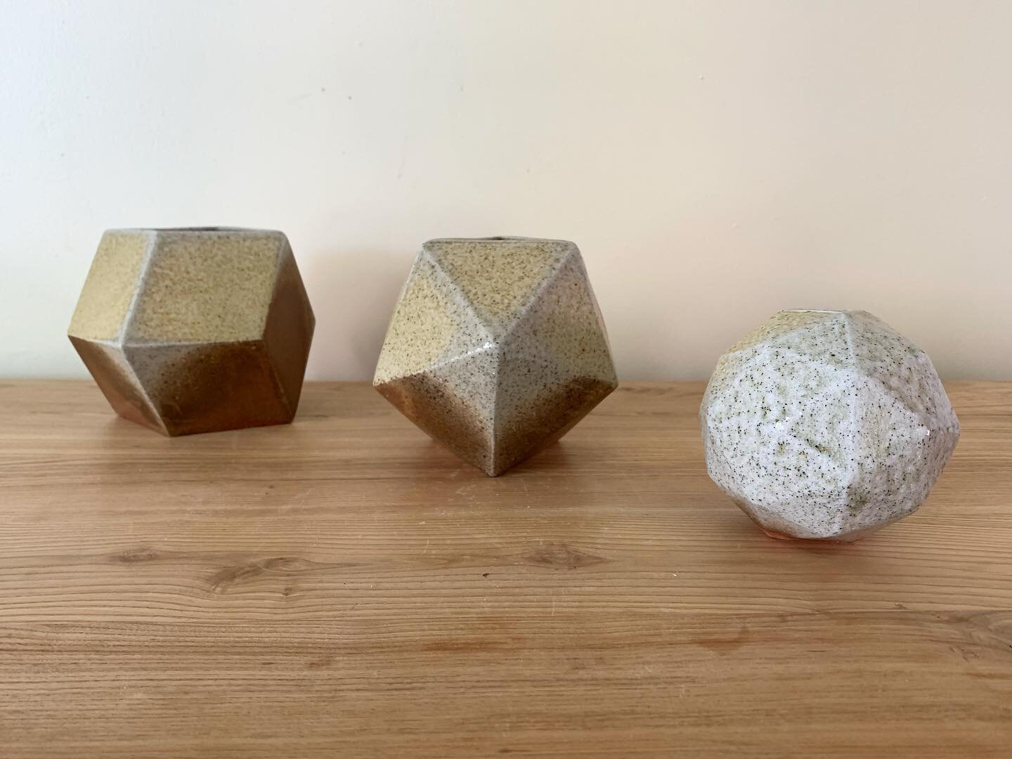 Three anagama fired porcelain slip-cast vases.  Made in part with kaolin from the Minnesota river valley.  The names of these are from left to right, rhombic dodecahedron, icosahedron, and the pentakis dodecahedron A few of these are still available.