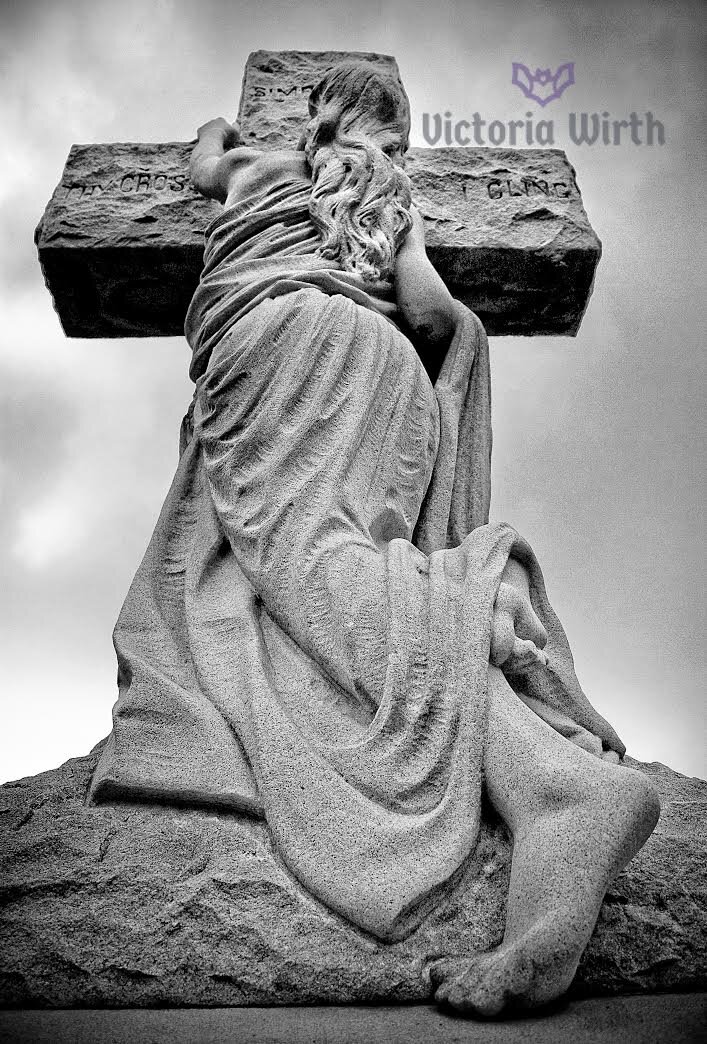  Victoria Wirth  Thy Cross I Cling  -Photo taken at the Laurel Hill Cemetery located in Philadelphia, Pennsylvania.  Prices Vary - Check Website  https://vwirthphoto.visualsociety.com/galleries/abandoned/thy-cross-i-cling  Contact: VWirthPhoto@gmail.