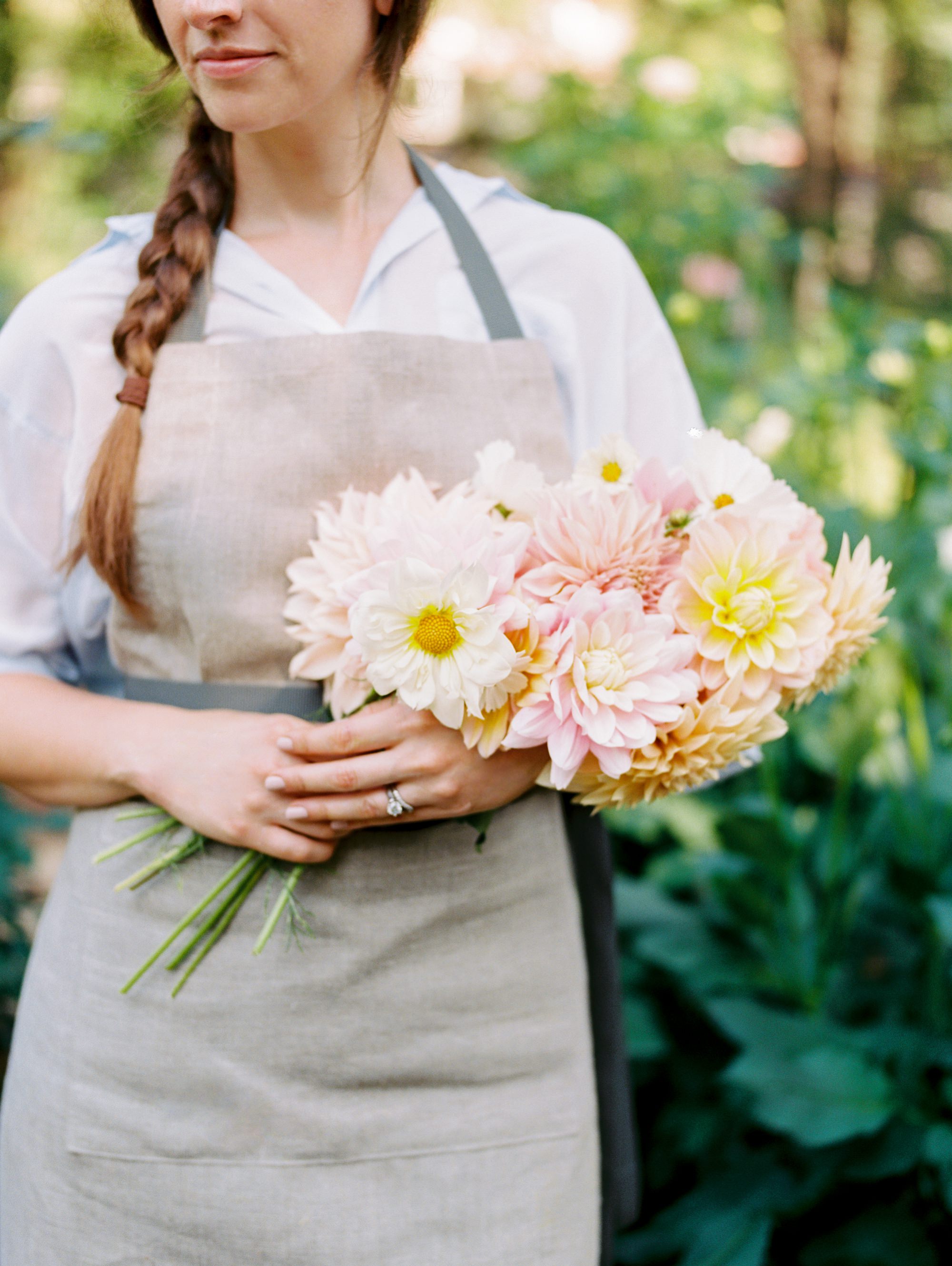  Jodi of  Provender Garden Kitchen  holds flowers grown from her home garden. 