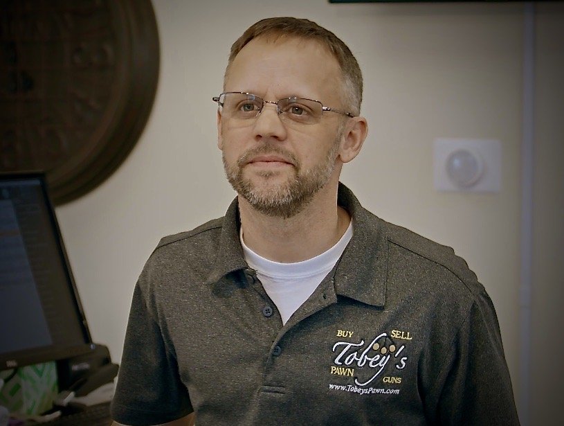 Toby M. Bouch as Pawn Shop Owner
