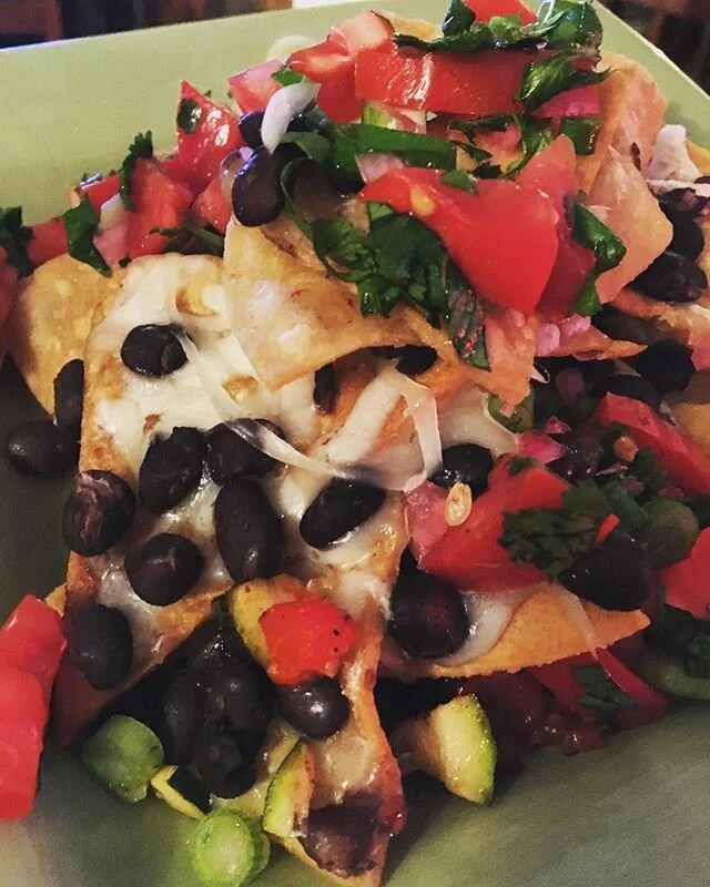 Nacho night! Freshly fried tortilla chips, freshly cooked black beans, chopped grilled zucchini and red bell peppers, melty Jack cheese and salsa fresca with pickled red onions #foodporn #homecooking #stayhome #staysafe #stayfull #dosdemayo
