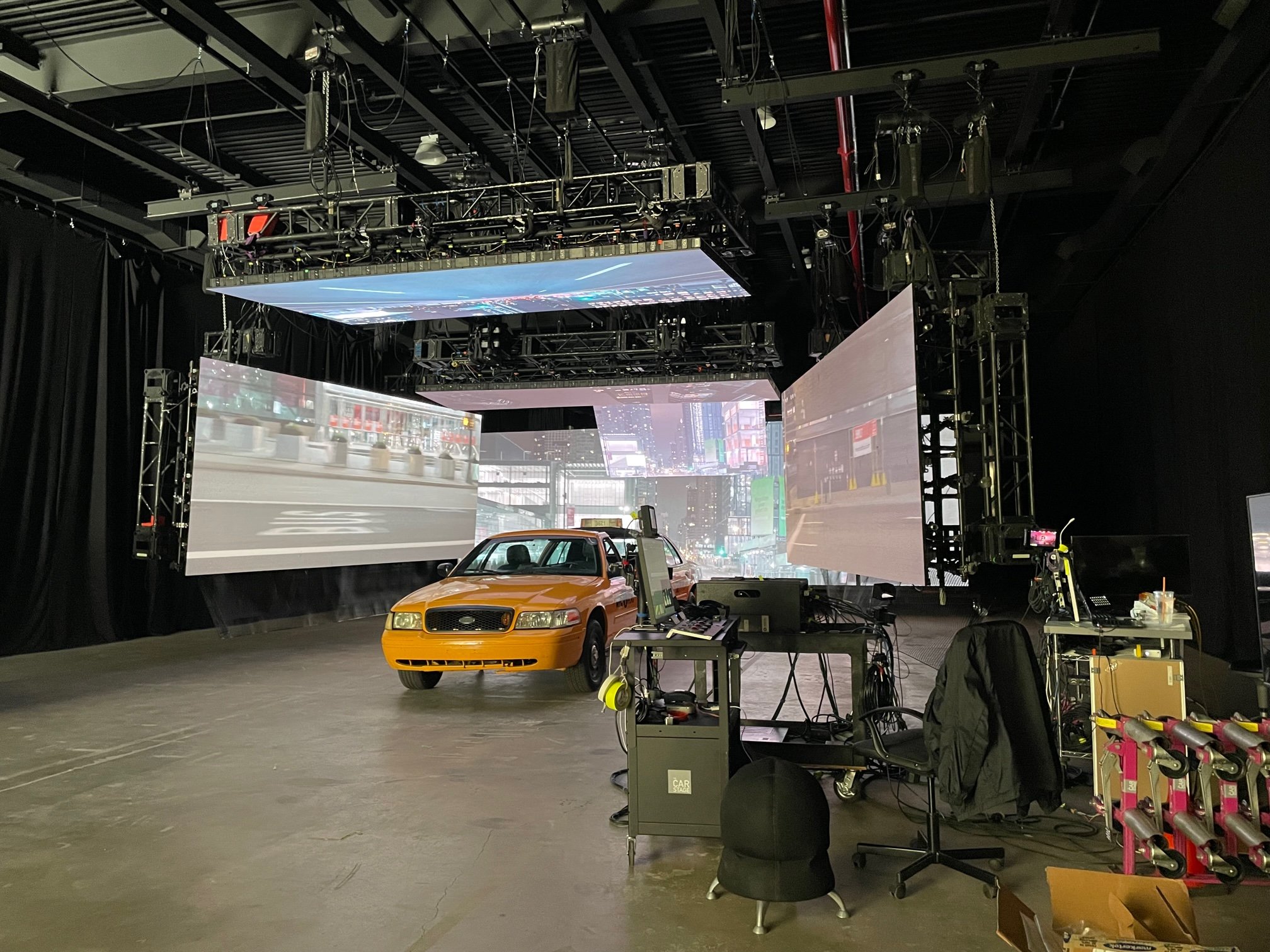 Split Taxi on set as Carstage Positions screen imagery