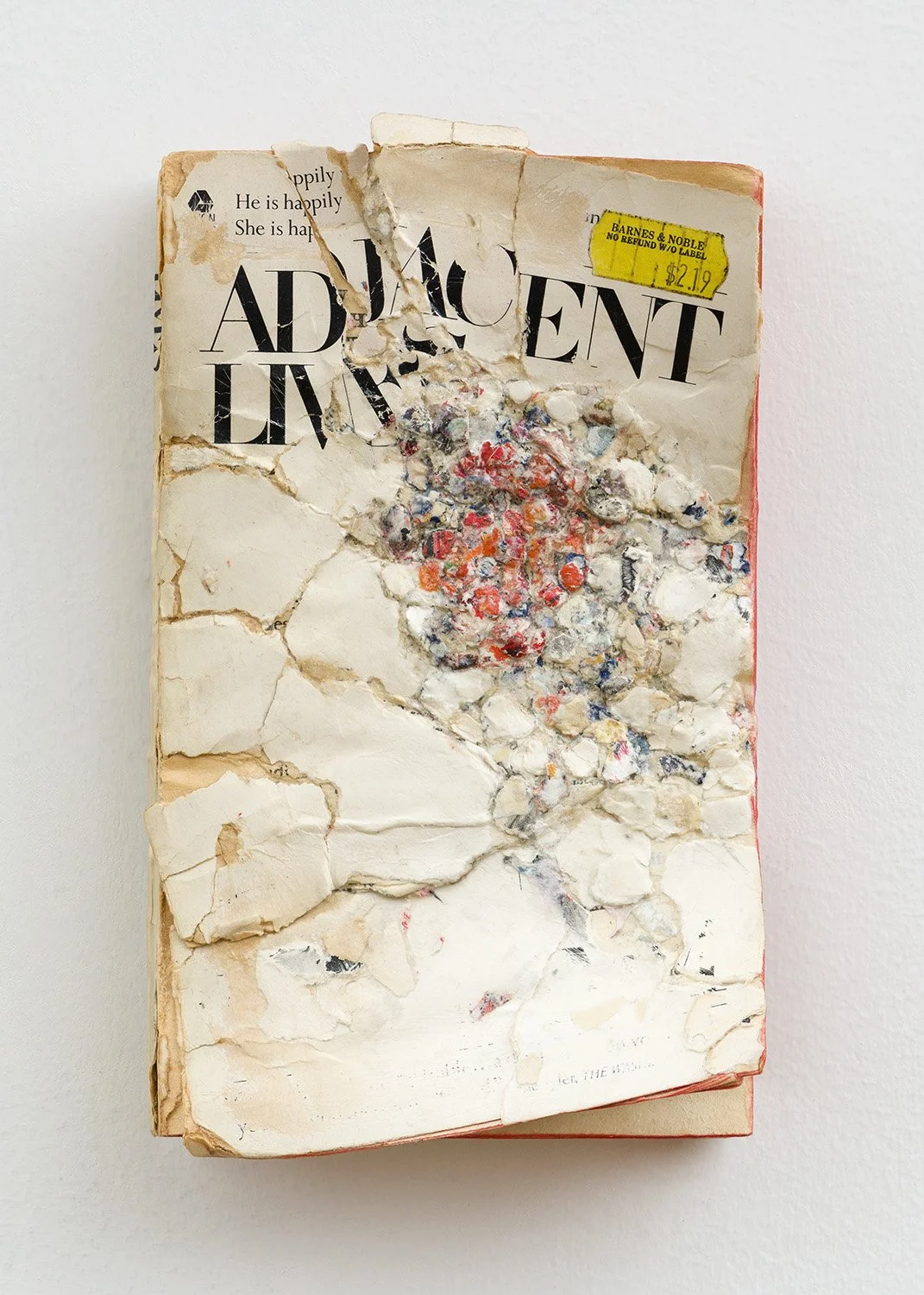 Adjacent Lives , 2021, Collage/decollage on paperback book, 7.25 x 4 x 2.25"