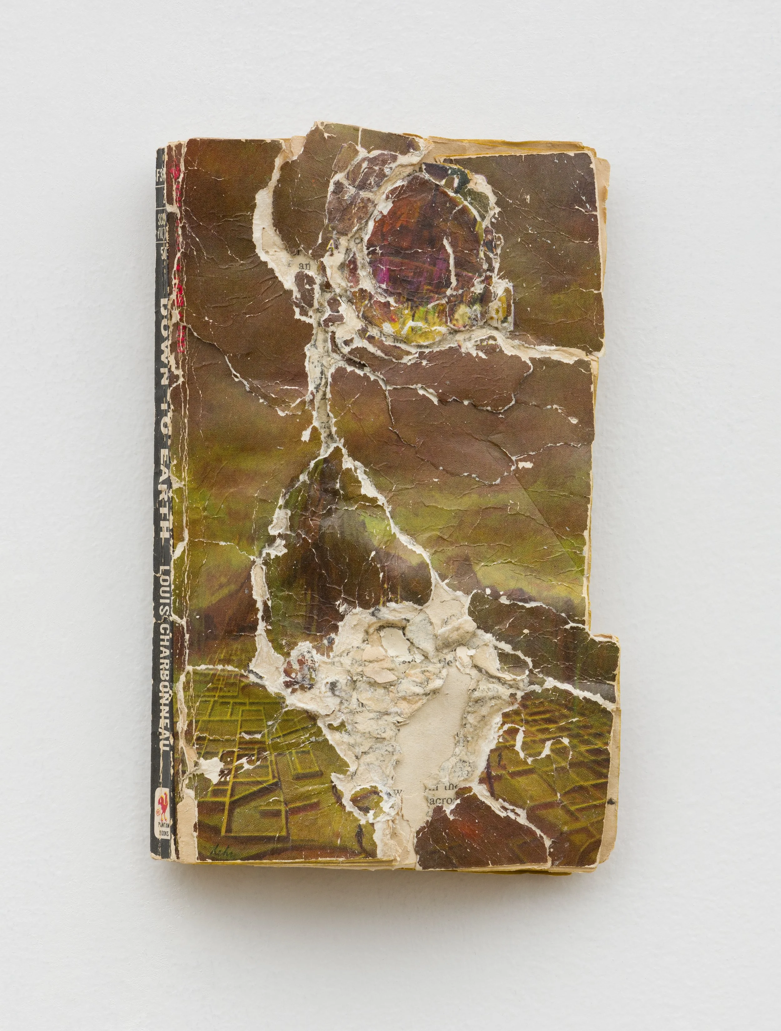 Down to Earth , 2024, Collage/decollage on paperback book, 7 x 5 x 1.25"