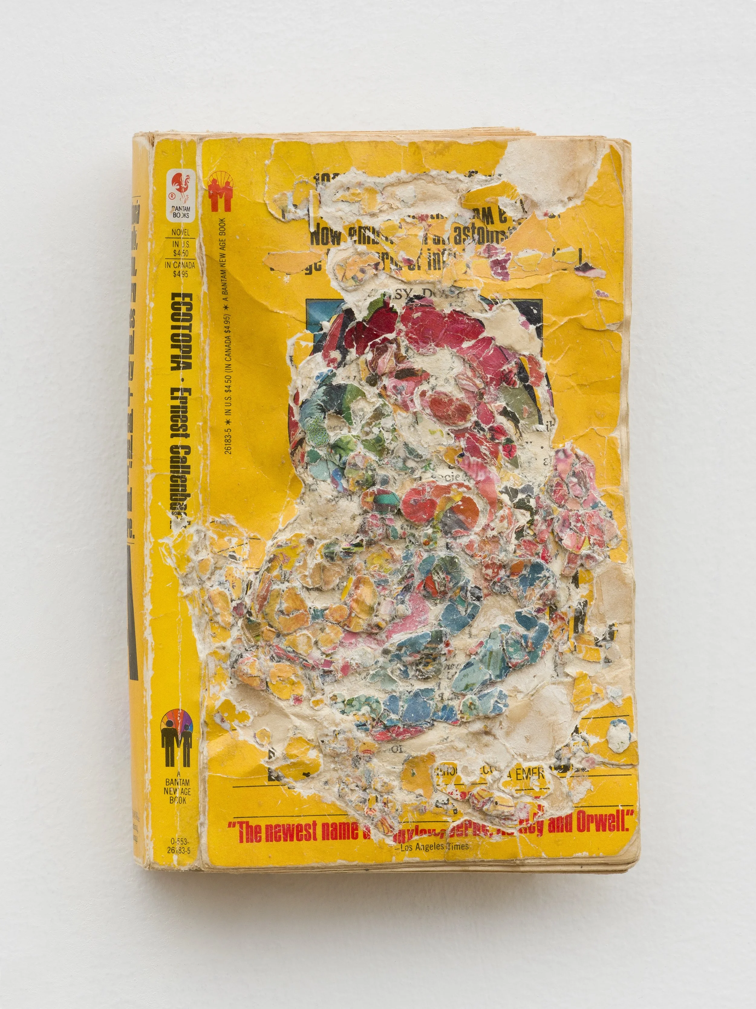 Ecotopia: A Future That Works , 2024, Collage/decollage on paperback book, 7 x 4.25 x .75"