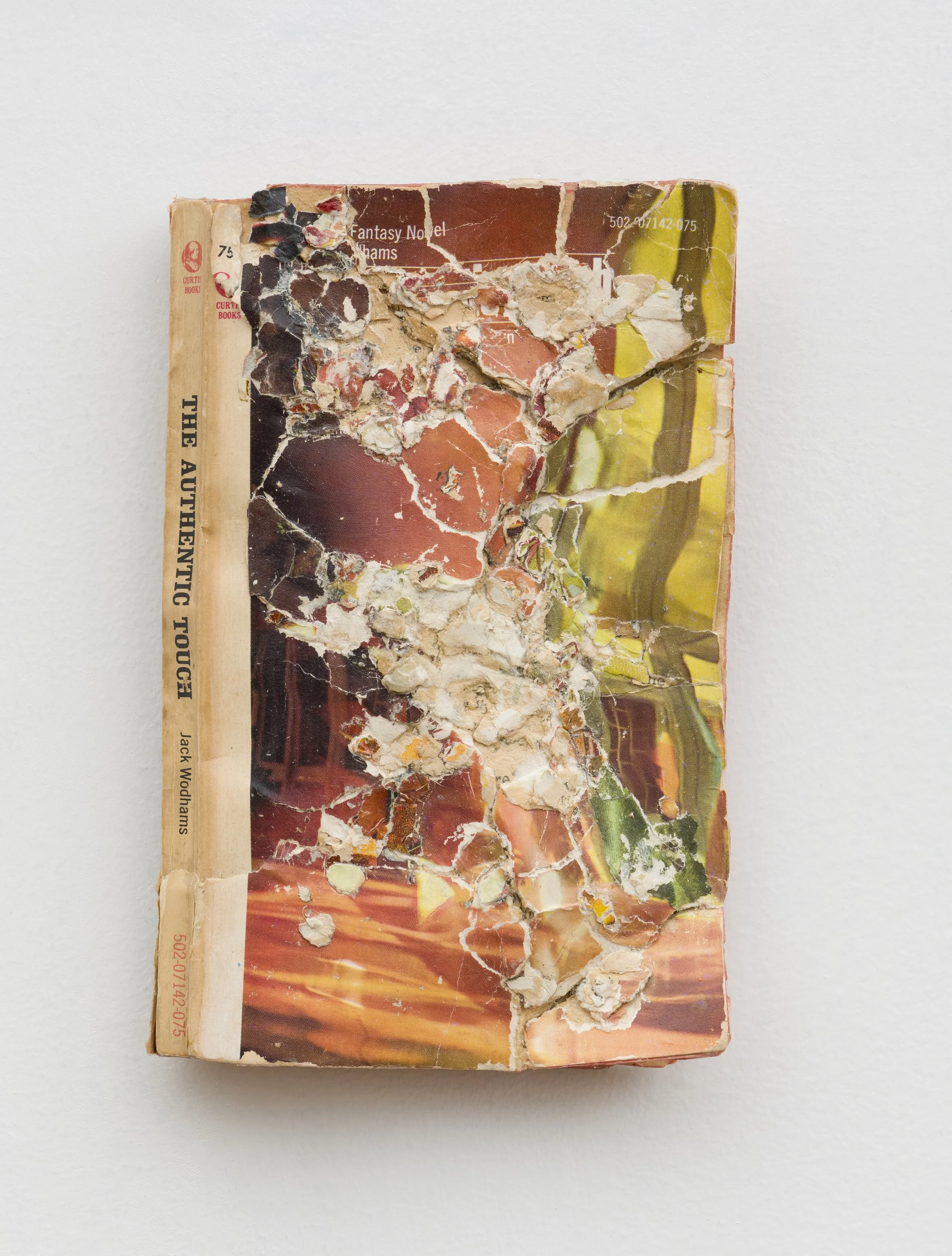 The Authentic Touch , 2024, Collage/decollage on paperback book, 7 x 4.5 x 1"