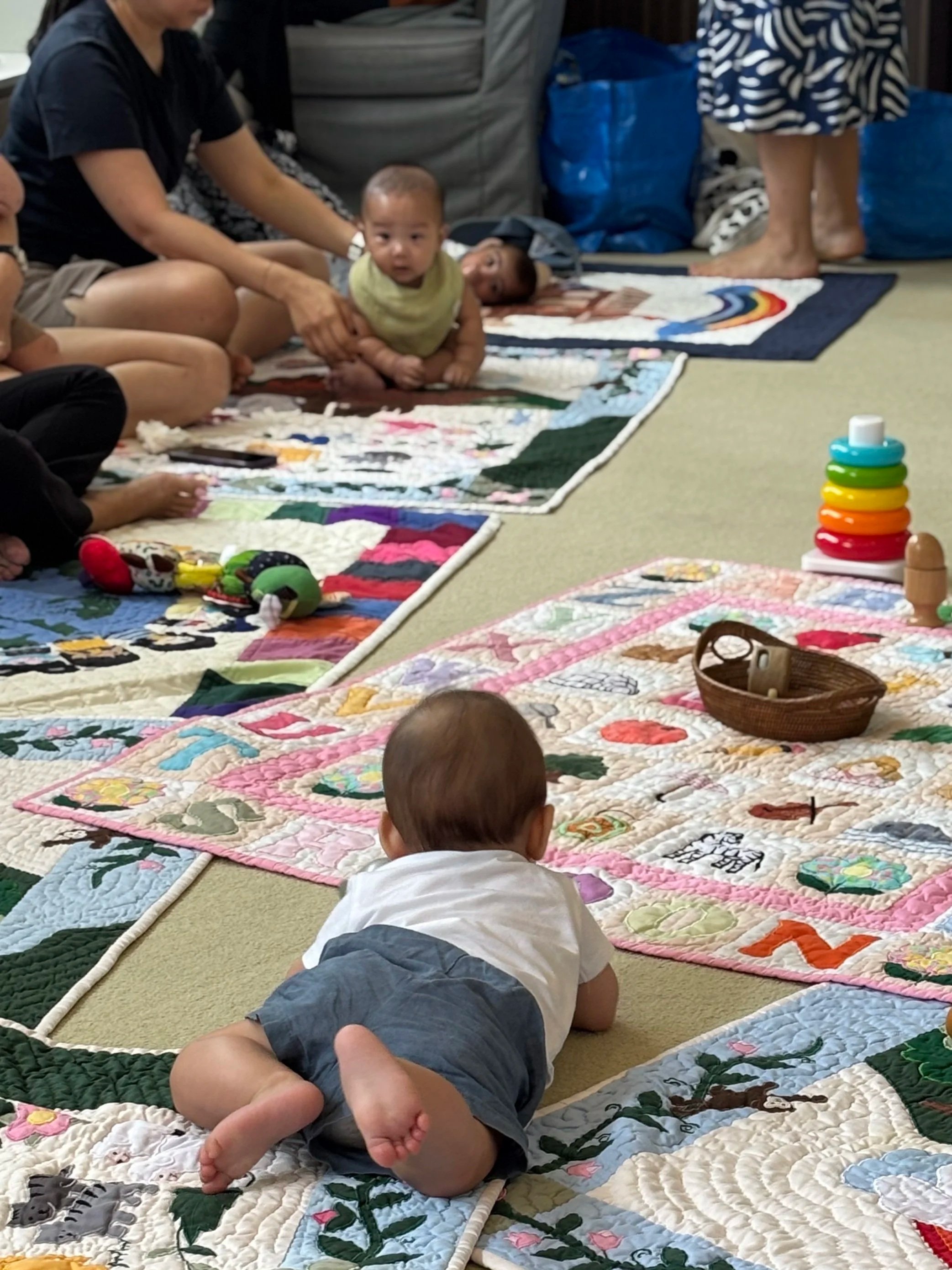 Mothers and babies enjoying tummy time, play and community at Mother & Child’s Baby Café in Singapore.