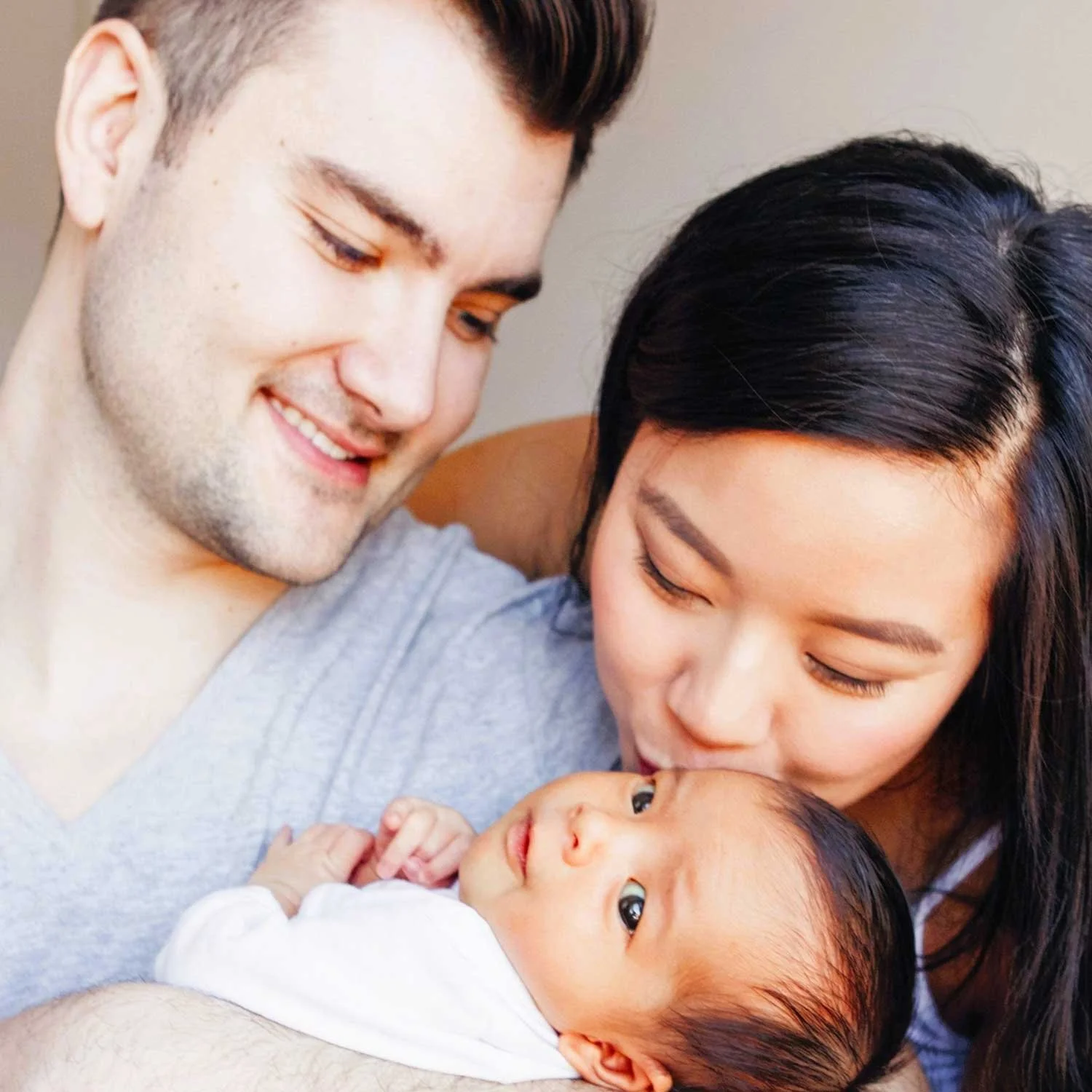 Parent learning baby care techniques during an Essential Babycare Bundle class in Singapore at Mother & Child