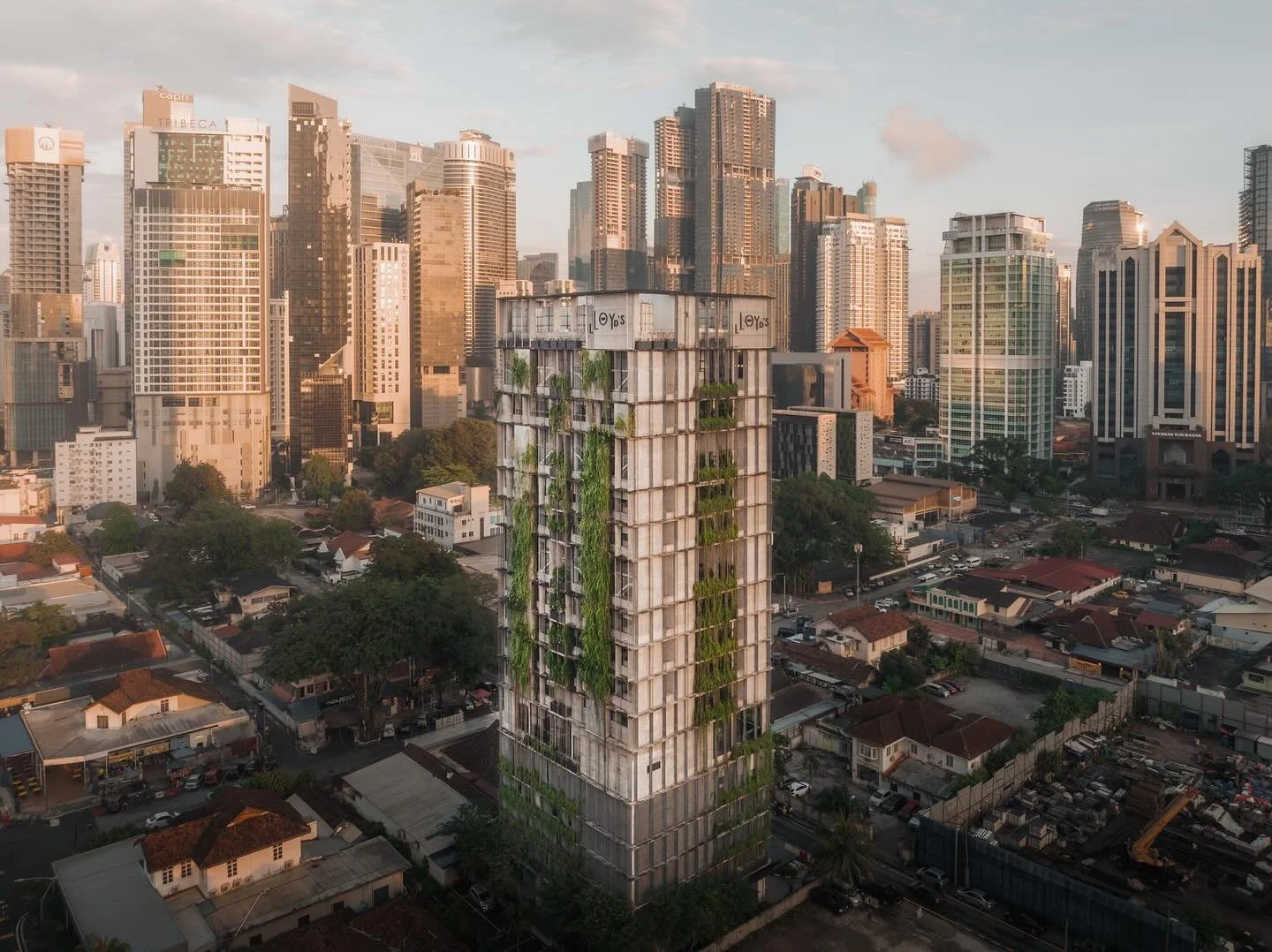 OPENING 1 APR 2024: @lloydsinn Kuala Lumpur: green &amp; raw facade against the backdrop of Kuala Lumpur&rsquo;s city skyline