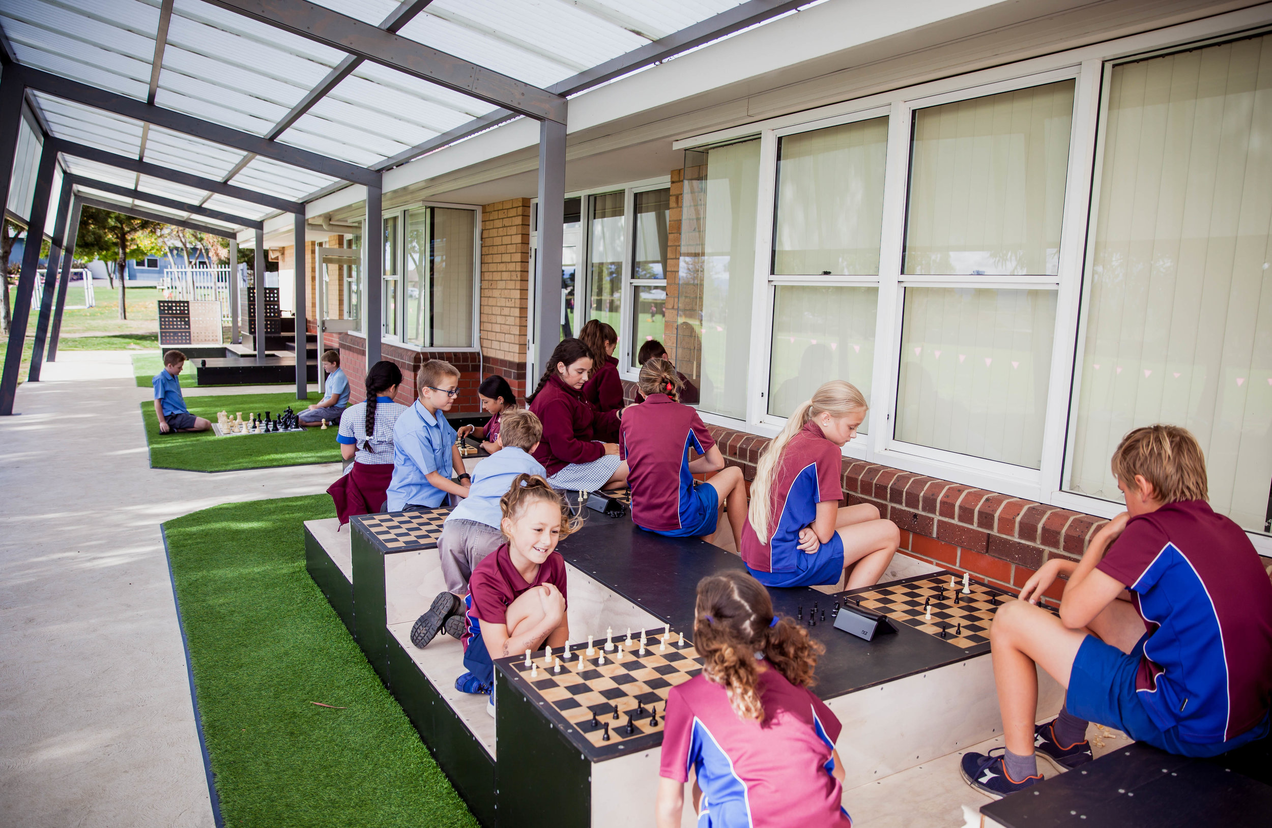 The veranda structure helps to mediate the transition between inside and outside. The play equipment can be used for; creative & cognitive based play; as an outdoor classroom; as a performance space; and is now home to the school's chess club.