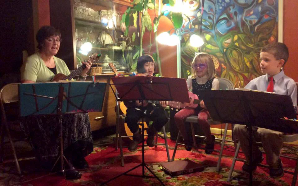 Leticia teaching a ukulele class near Hadley Massachusetts