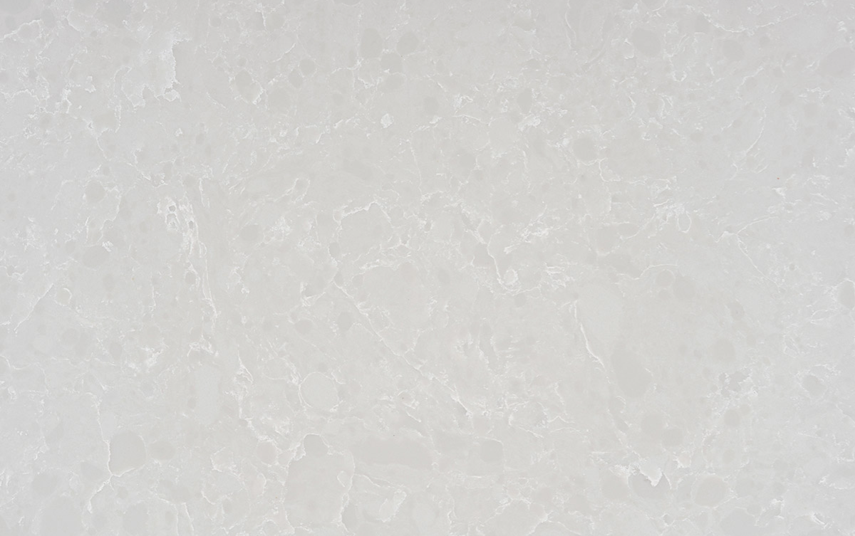 Close up of Dior White quartz prefab with a natural stone look, it is a quartz with subtle veins.