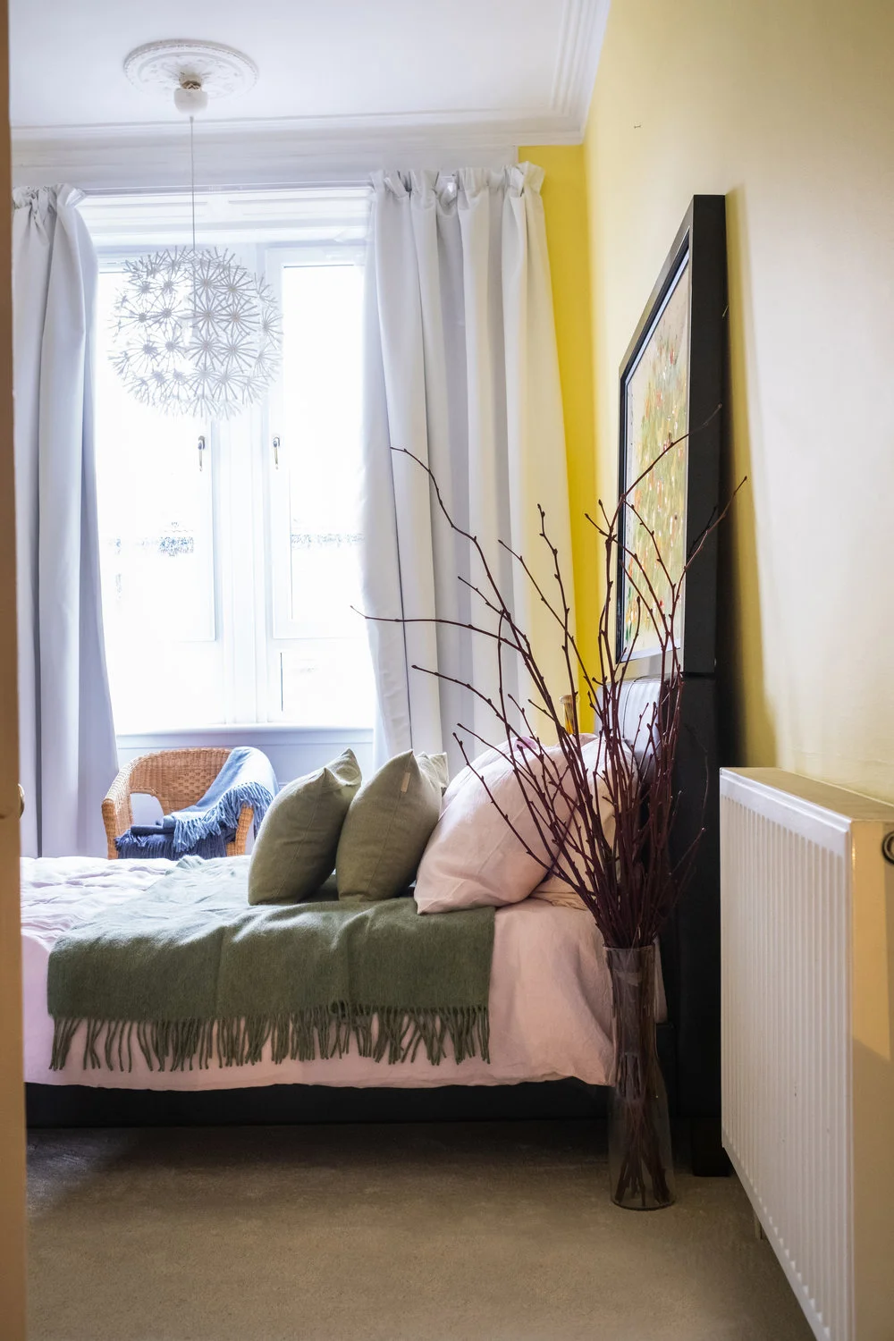 bedroom, sun light, big window, painting, throw, cushions, green, blue, pink