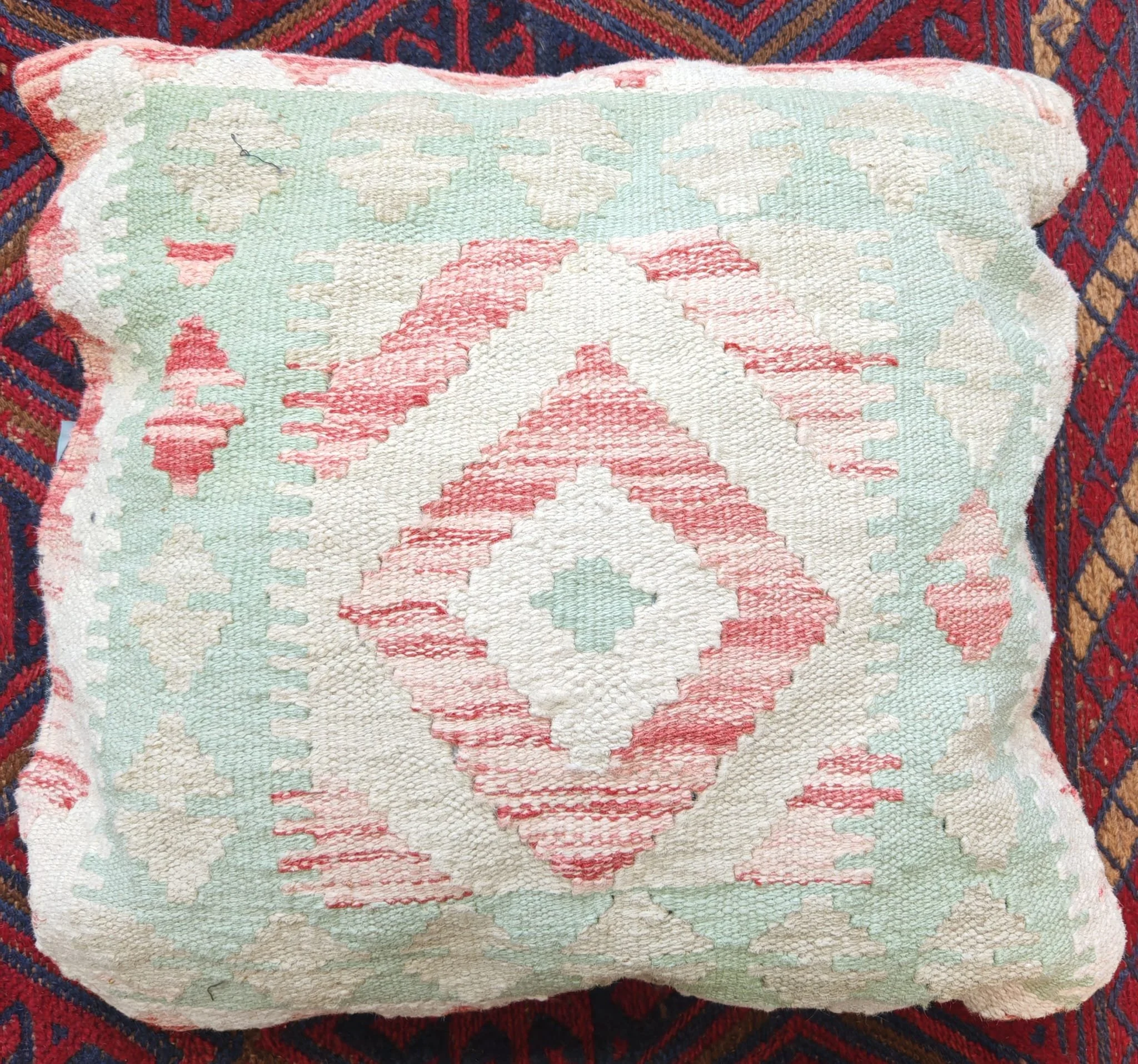 Oriental colourful  woollen cushion pale