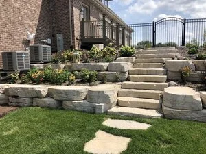 How a Deck Builder Can Plan a Deck Around a Retaining Wall in New Lenox, IL