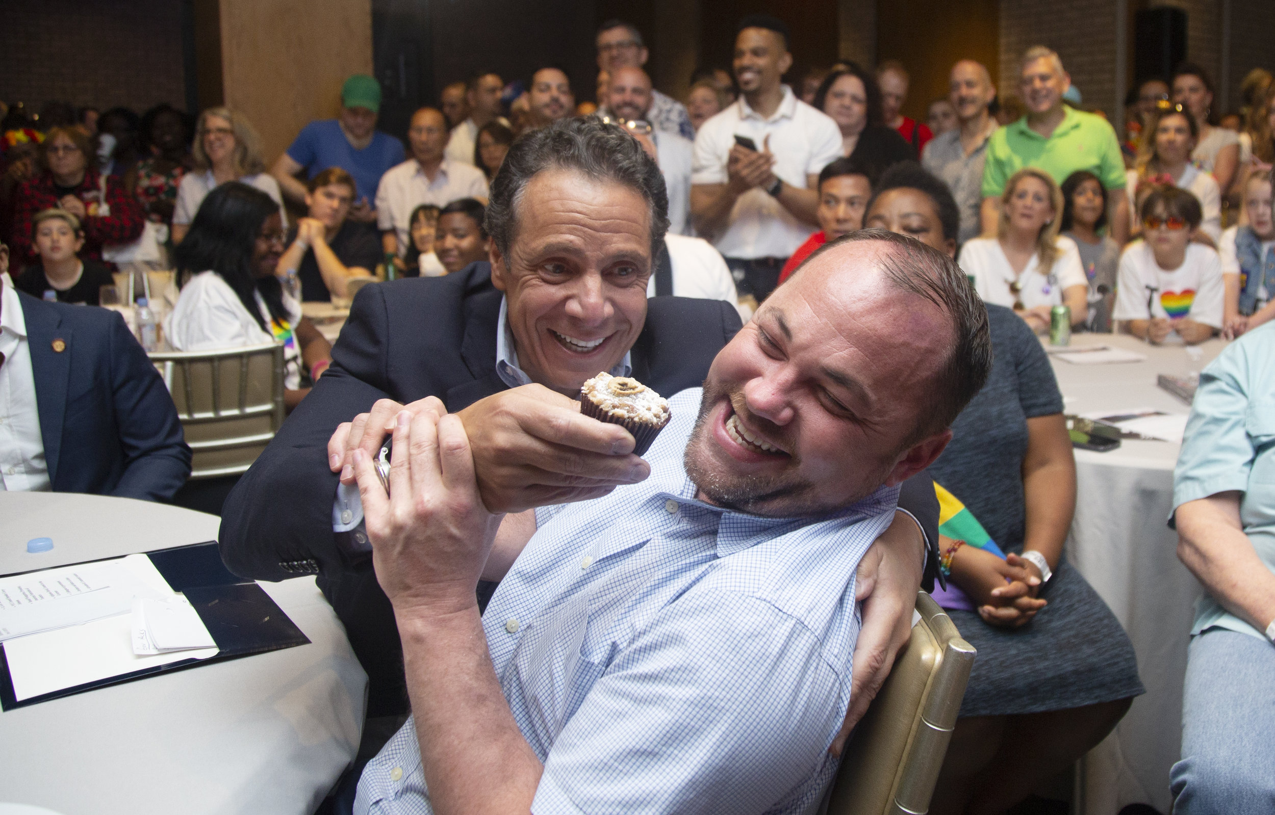 City Council Speaker Corey Johnson And Governor Andrew Cuomo Share A Moment During A LGBT Pride Breakfast Event