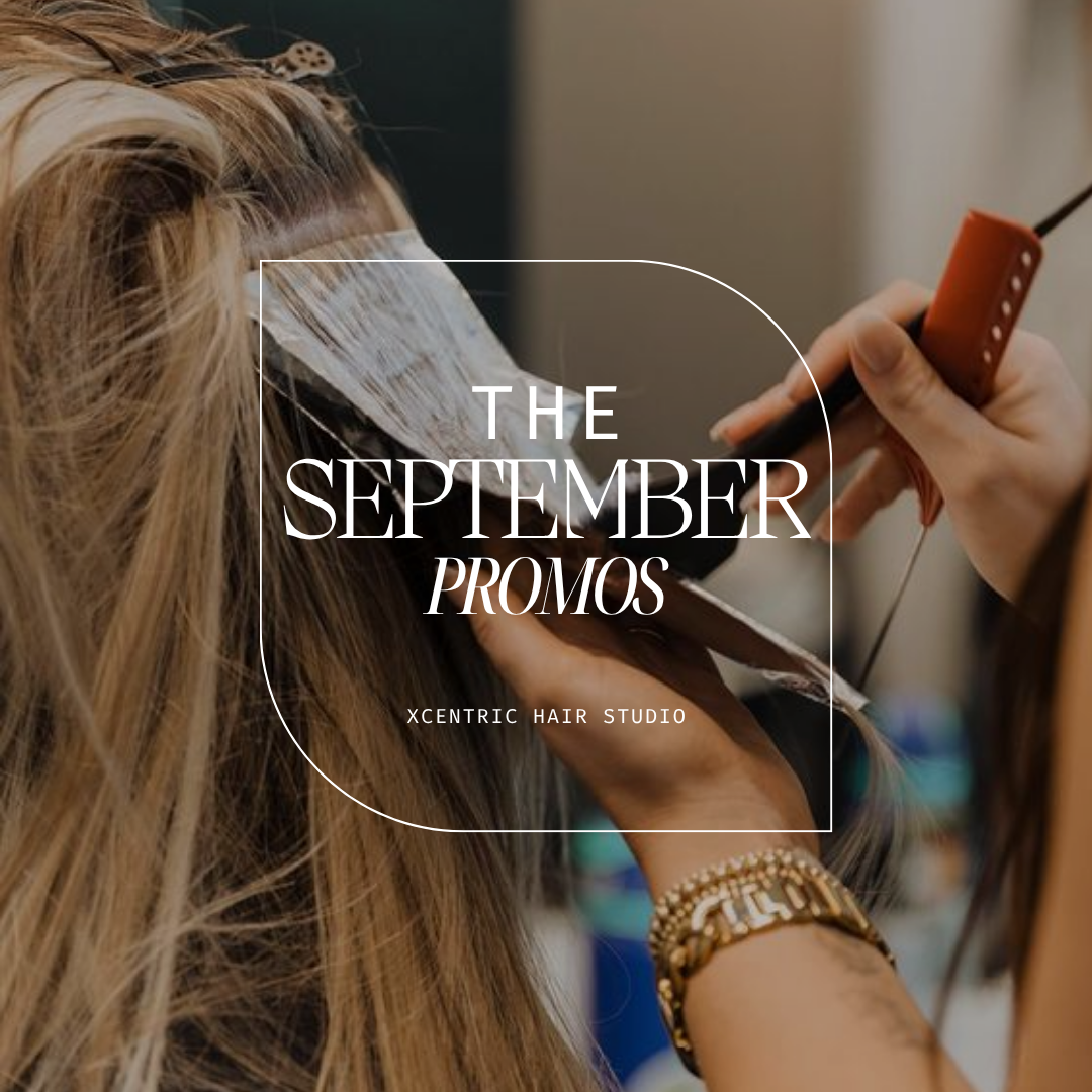 Hair stylist applying a hair treatment or color to a woman's hair in a salon.
