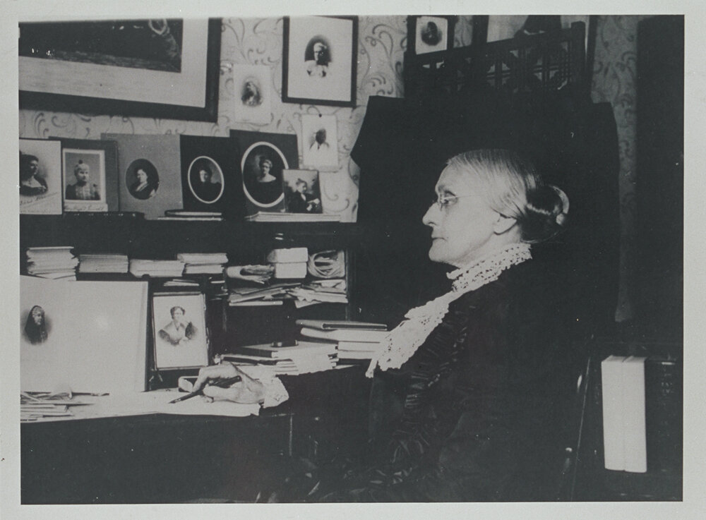 Susan B. Anthony sitting at desk   (Getty Images)