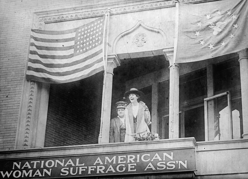 Jeannette Rankin (right) on NAWSA headquarters balcony   (Library of Congress)