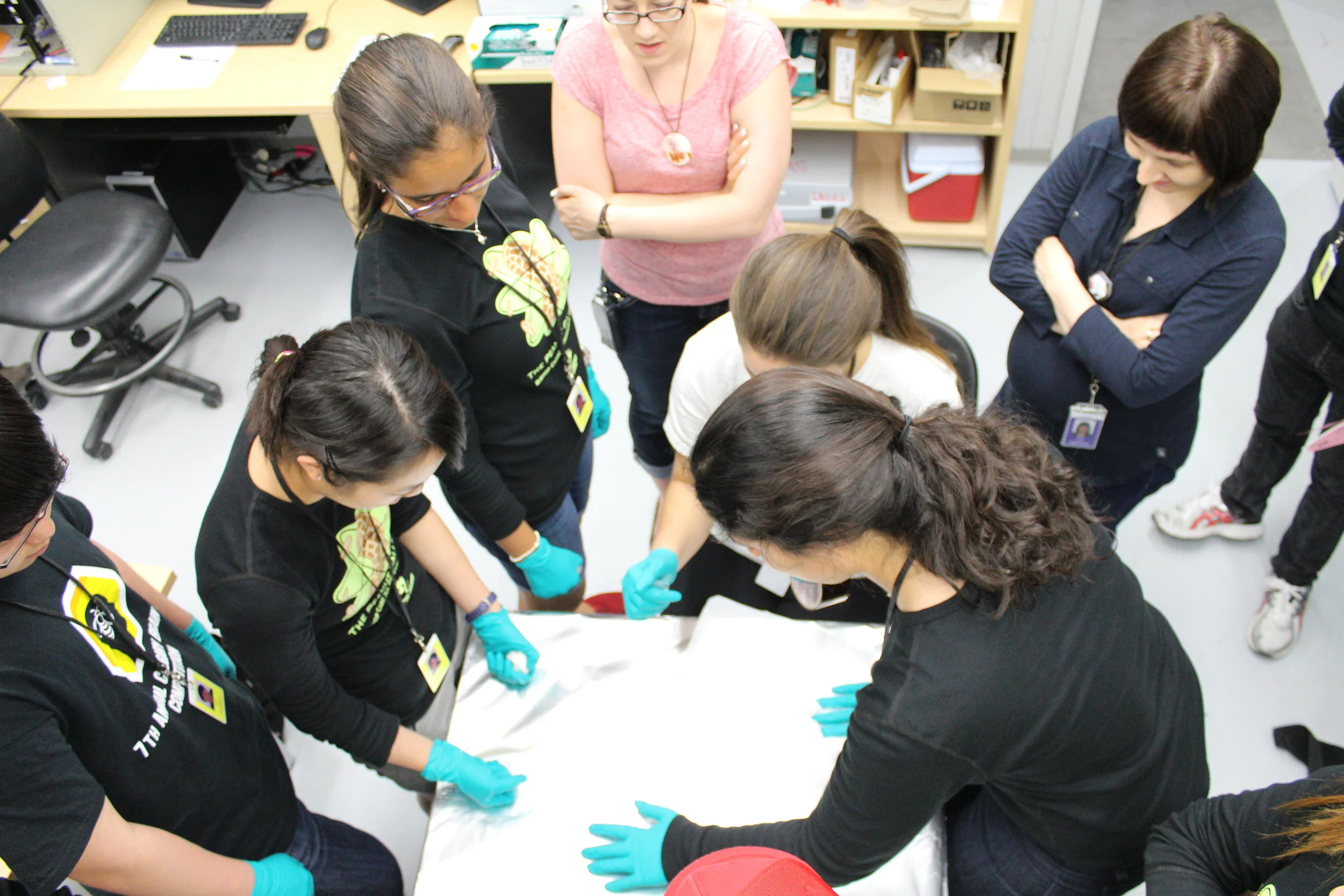  The students from Bishop Carroll High School (Calgary, Alberta) during sample preparation at the IDEAS beamline. They were investigating the airborne transmission of peanut proteins and also researching selenium in nuts and supplements (2014). 