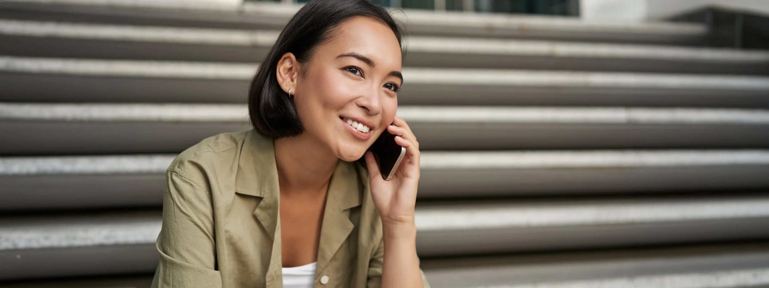 portrait-beautiful-asian-girl-talks-mobile-phone-sits-street-stairs-woman-with-smartphone.jpg