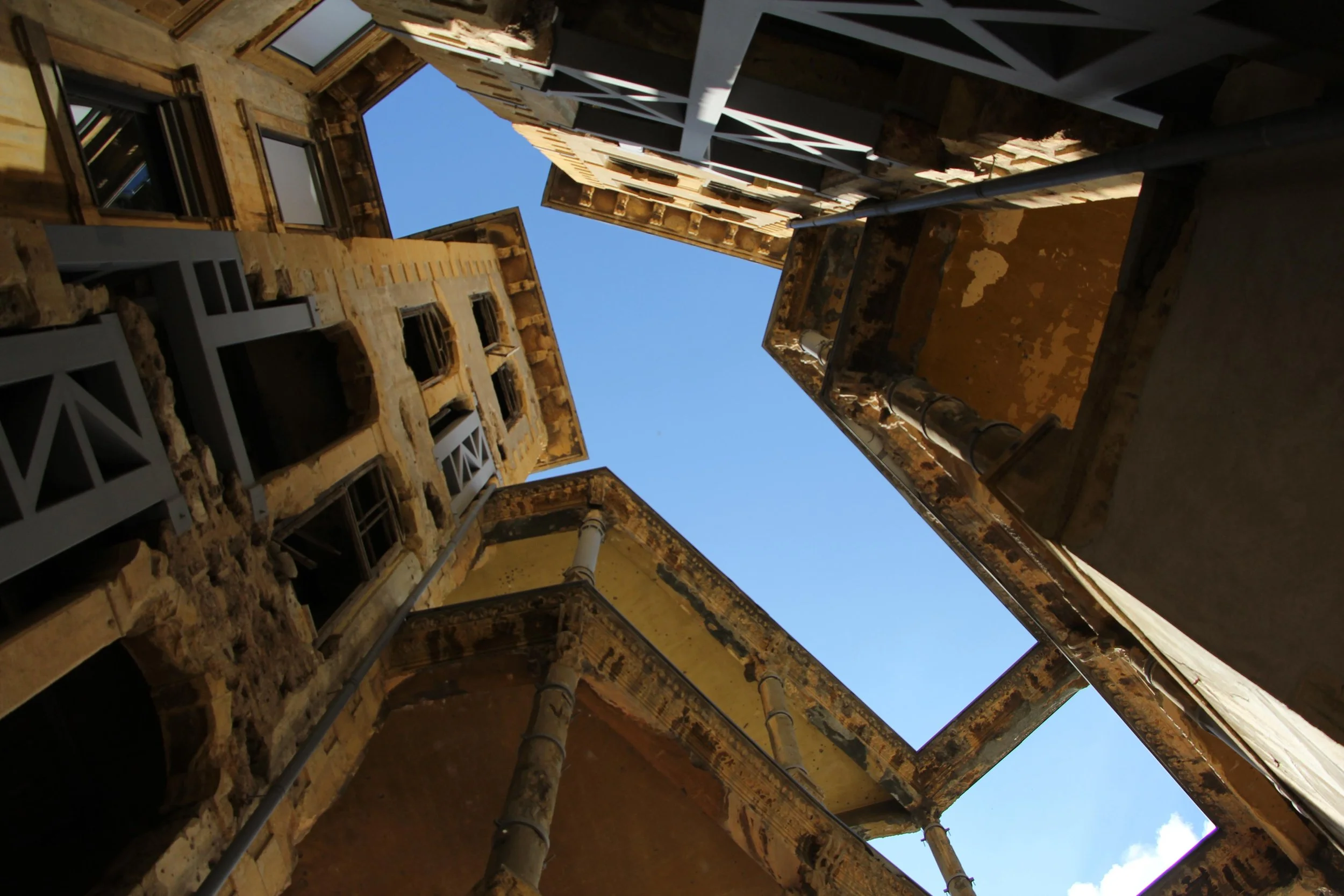 Damage and absence are part of the building's memory.