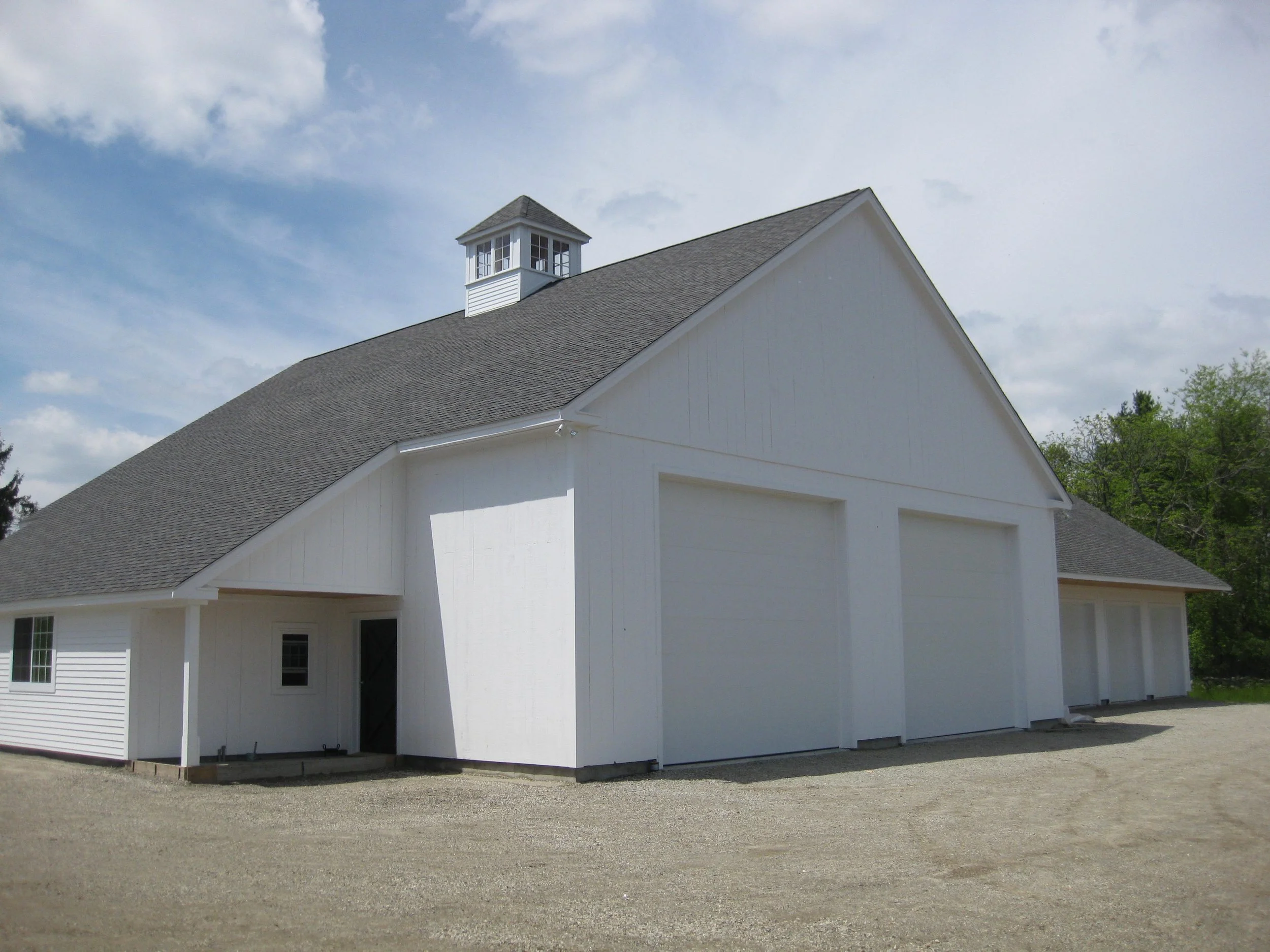 Apple_Crest_Garage_rear view with cupola and enclosed barn style overhang_36x60_G516