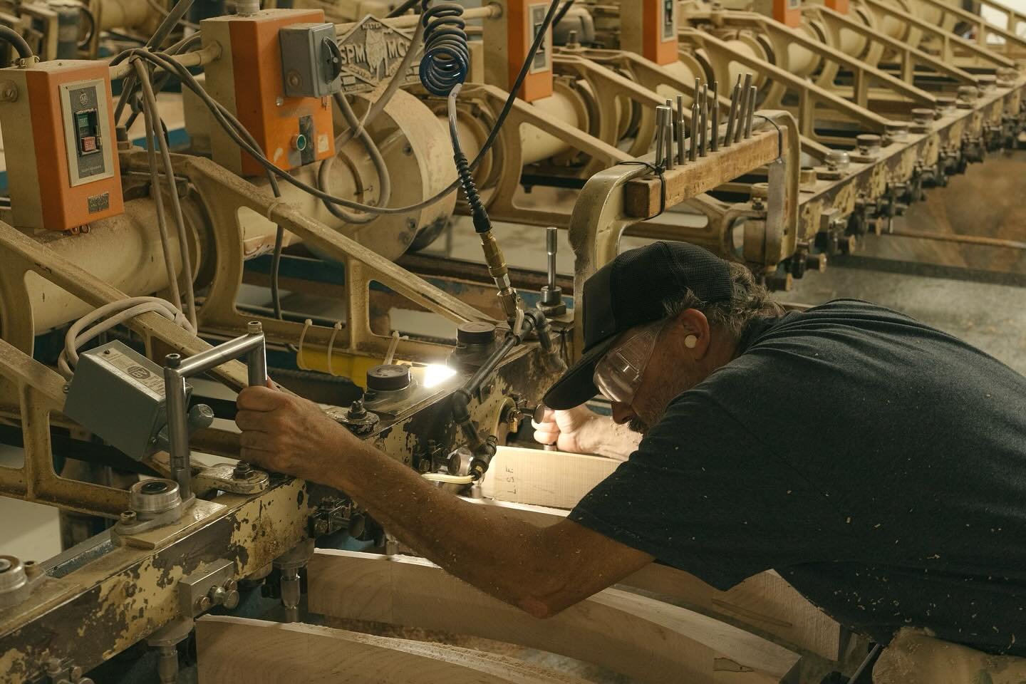 A machine that cuts multiple legs at once for furniture in the Hickory Chair plant in Hickory, NC. This machine is the only one like it in production and only a handful of individuals at this plant know how to operate it. I was mesmerized watching th