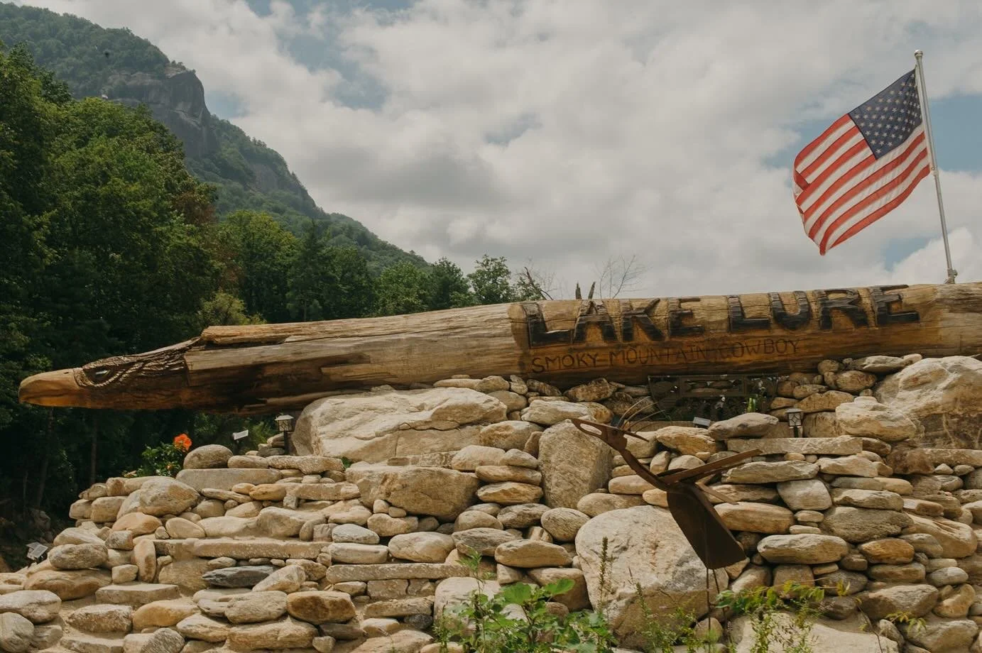 More sights from Chimney Rock. A muddy guitar beside a disheveled bed. A mud turtle. A piece of road laying beside the river. Bikers from South Carolina here to enjoy a hamburger. A post revealing remediated flood damage. Sitting. Waiting. Watching. 