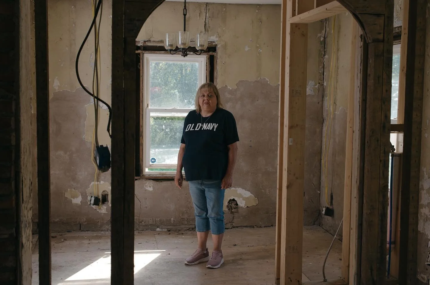 Michelle Parker in her home in Clyde on Sept 19, 2025 that flooded once during hurricane Fred and a year after having her home remodeled Helene hit her home again. She was able to receive a camper to live in while she waited for a new home. Then her 