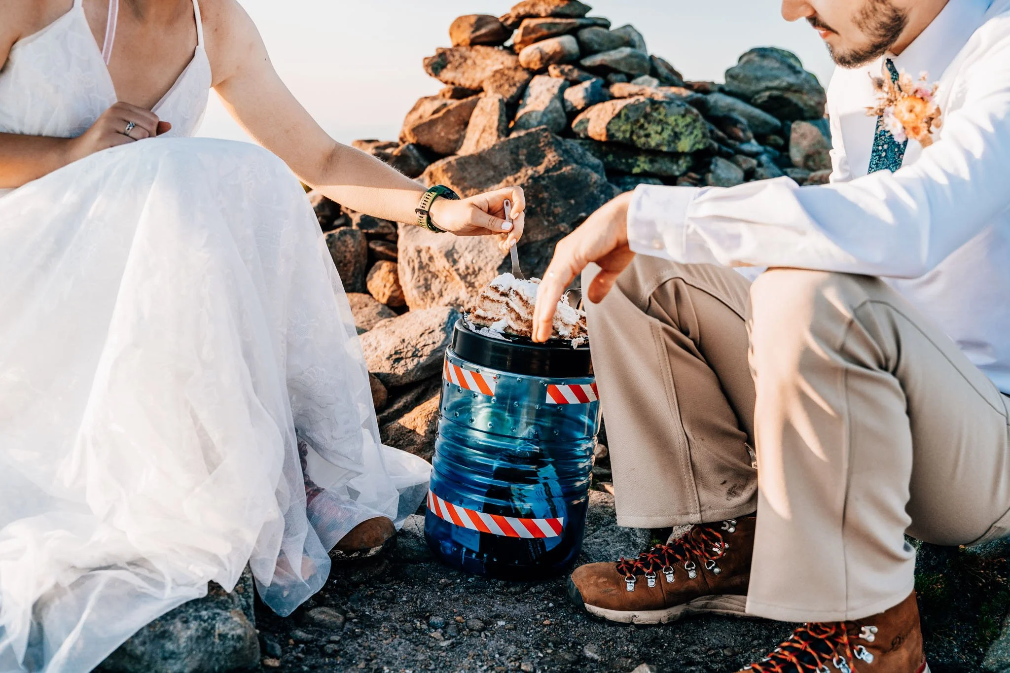 Adventure elopement inspo cake cutting on a mountain