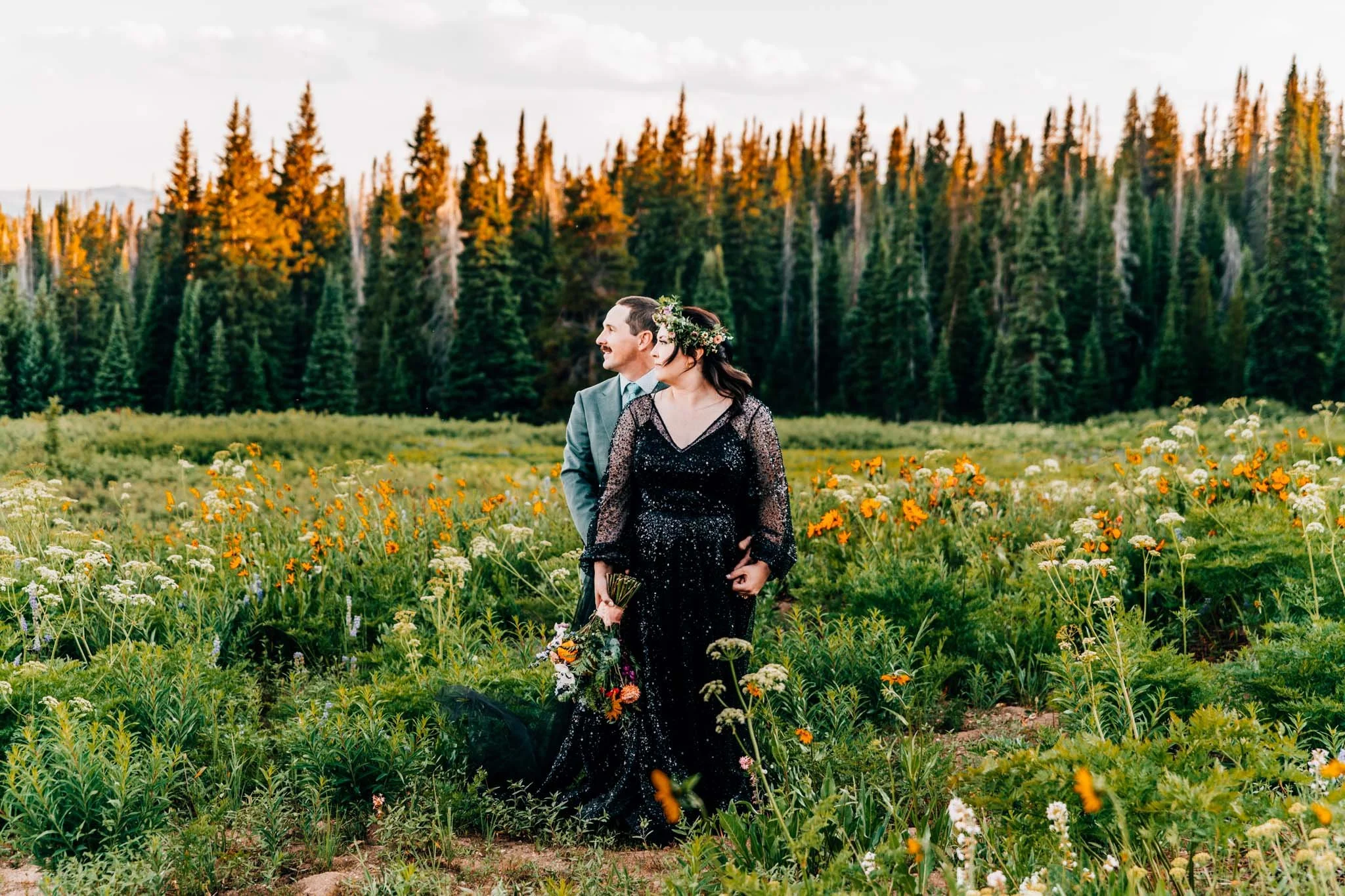 Couple eloping in a wildflower meadow in colorado