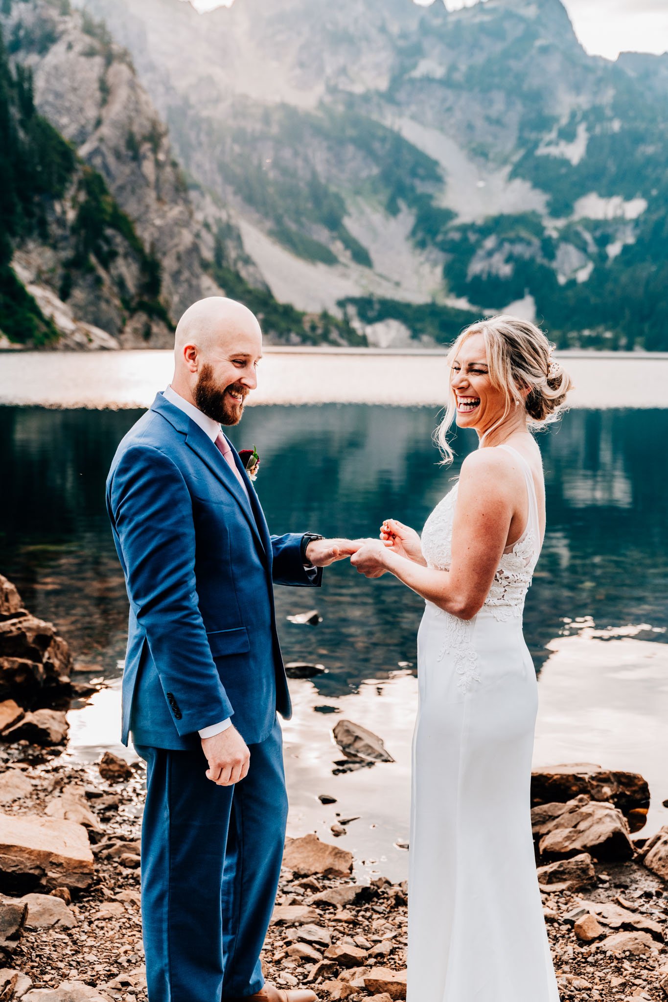 Couple eloping on a mountain lake in the rockies