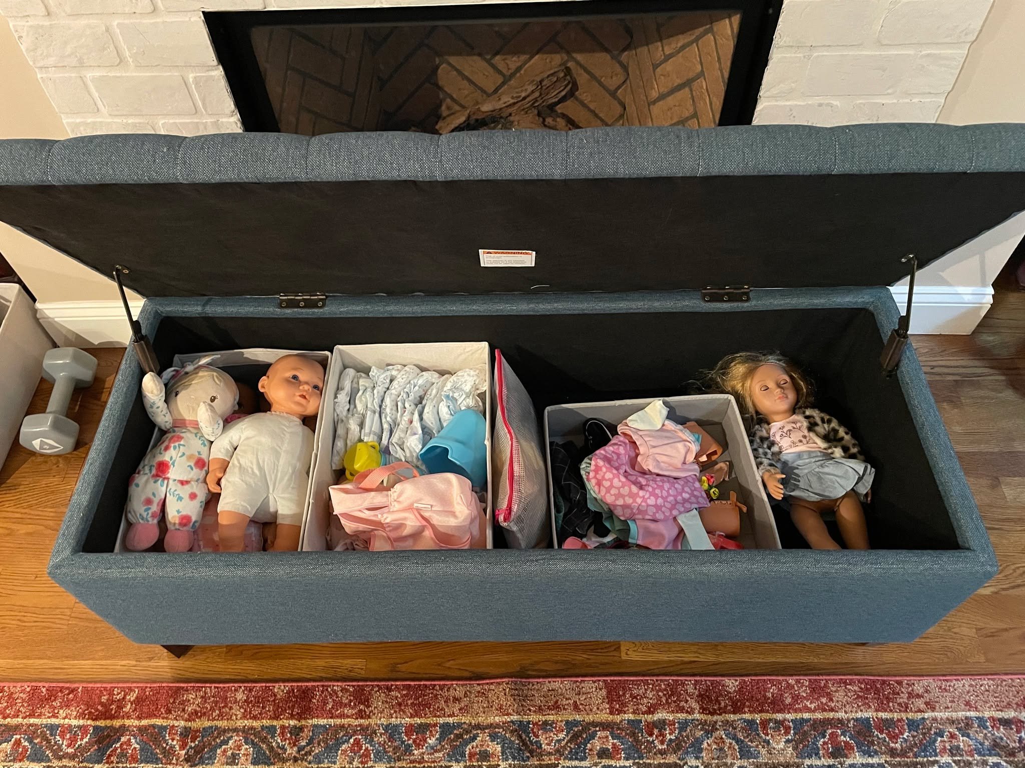 We love a storage ottoman to hide away toys but we love a storage ottoman with divided, dedicated spaces for certain toys even more! 

We suggest keeping similar items together making it easier for your littles to keep it clean and organized themselv