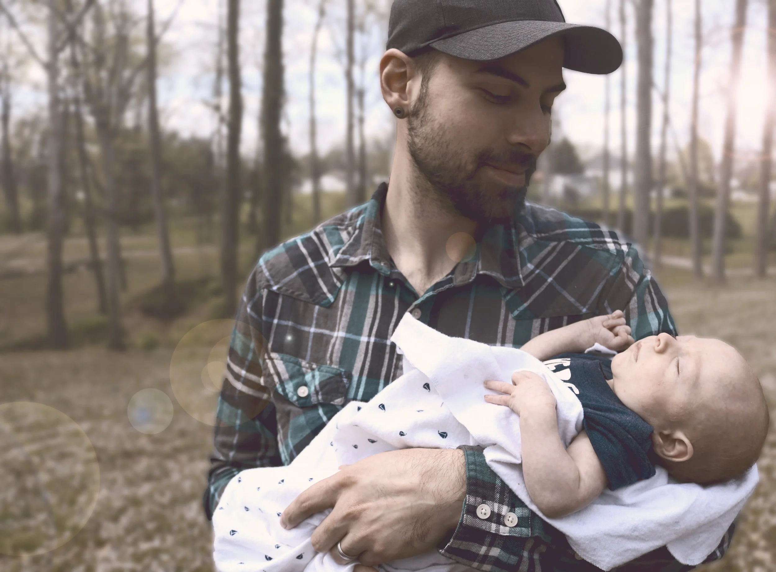 Canva - Man Holding Baby during Daytime.jpg