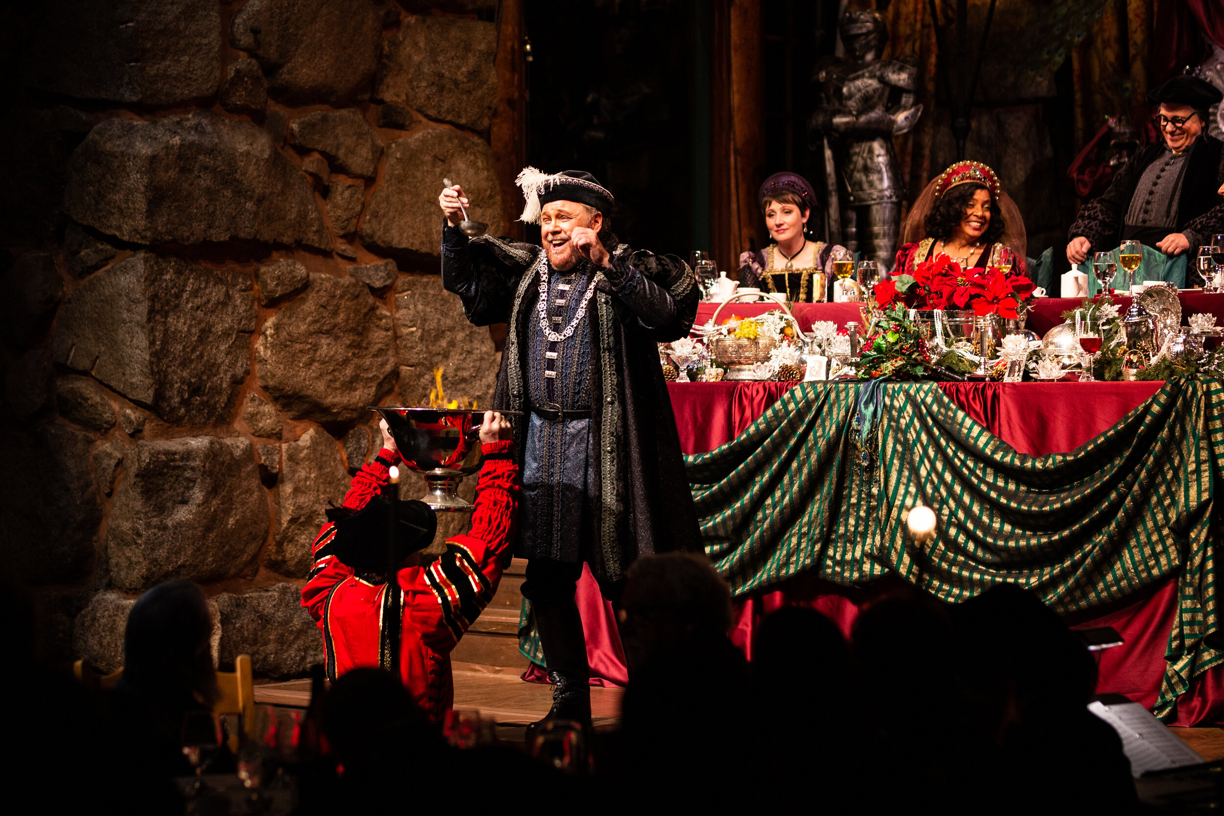  Squire Bracebridge (Jonathan Spencer) savors a sip from the Wassail bowl before entreating his guests to “…drink to joy this Christmas night!” The Bracebridge Dinner at Yosemite 2018 Photo courtesy of Andrea Fulton Productions 