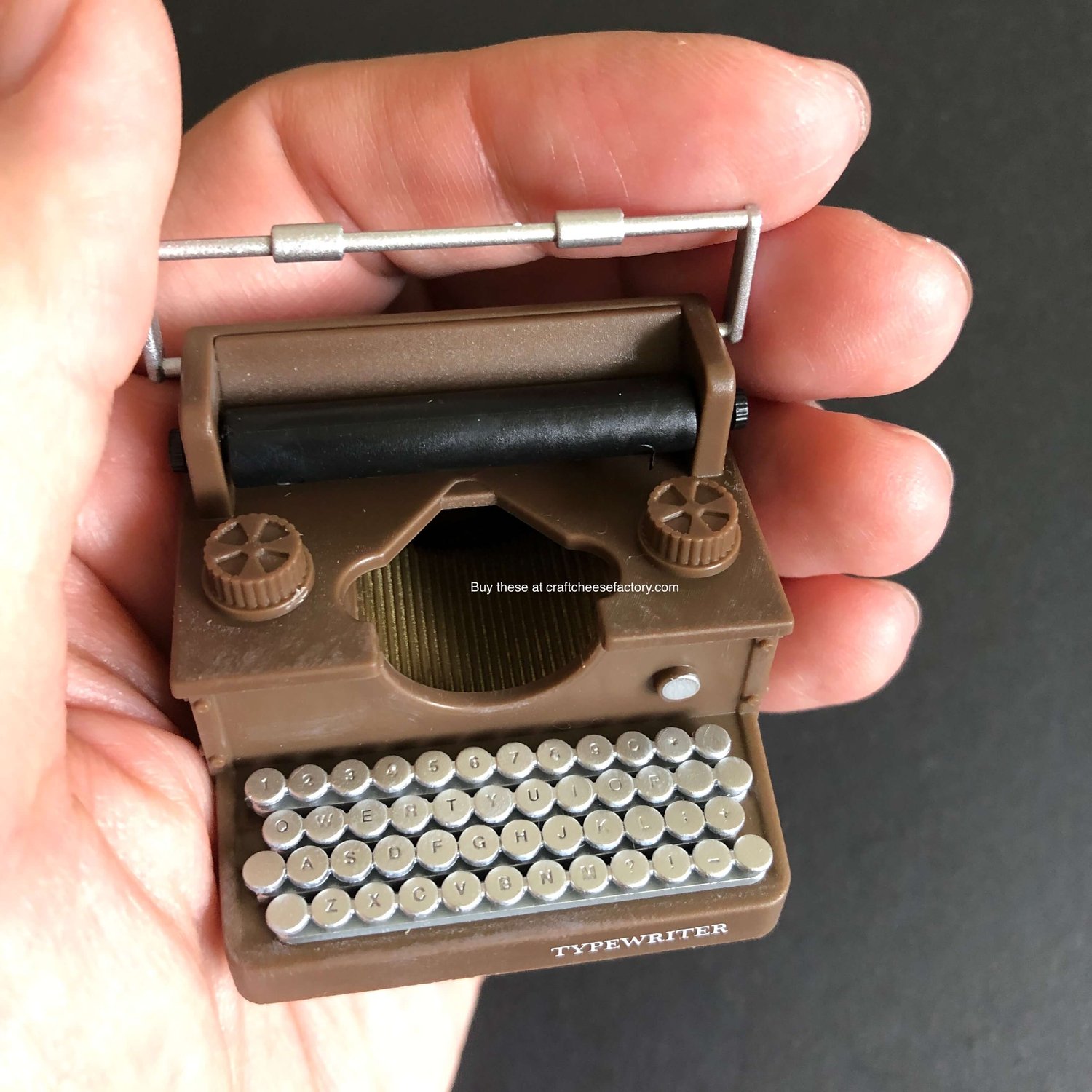 Vintage-style miniature toy typewriter —