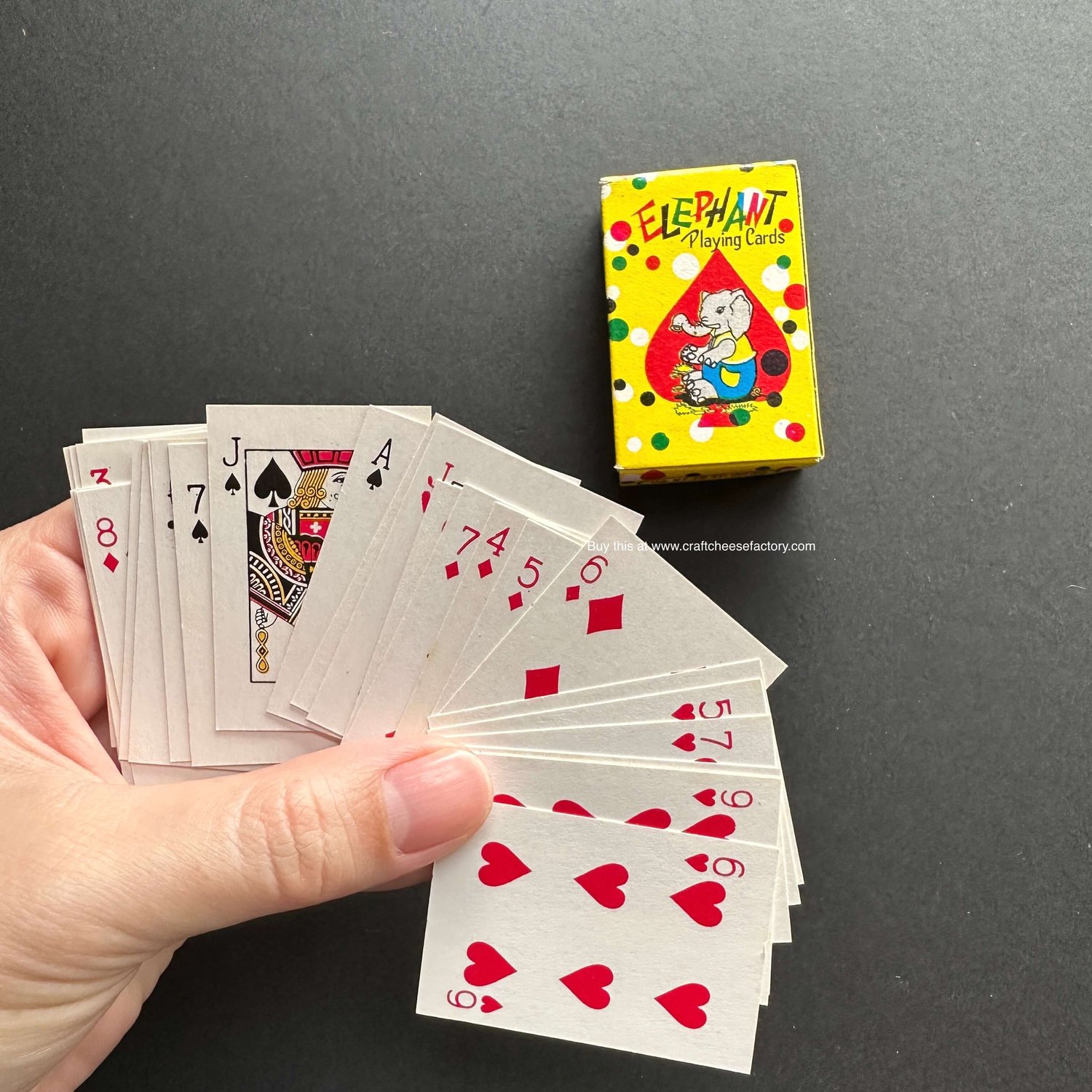 Vintage doll-size miniature toy playing poker cards