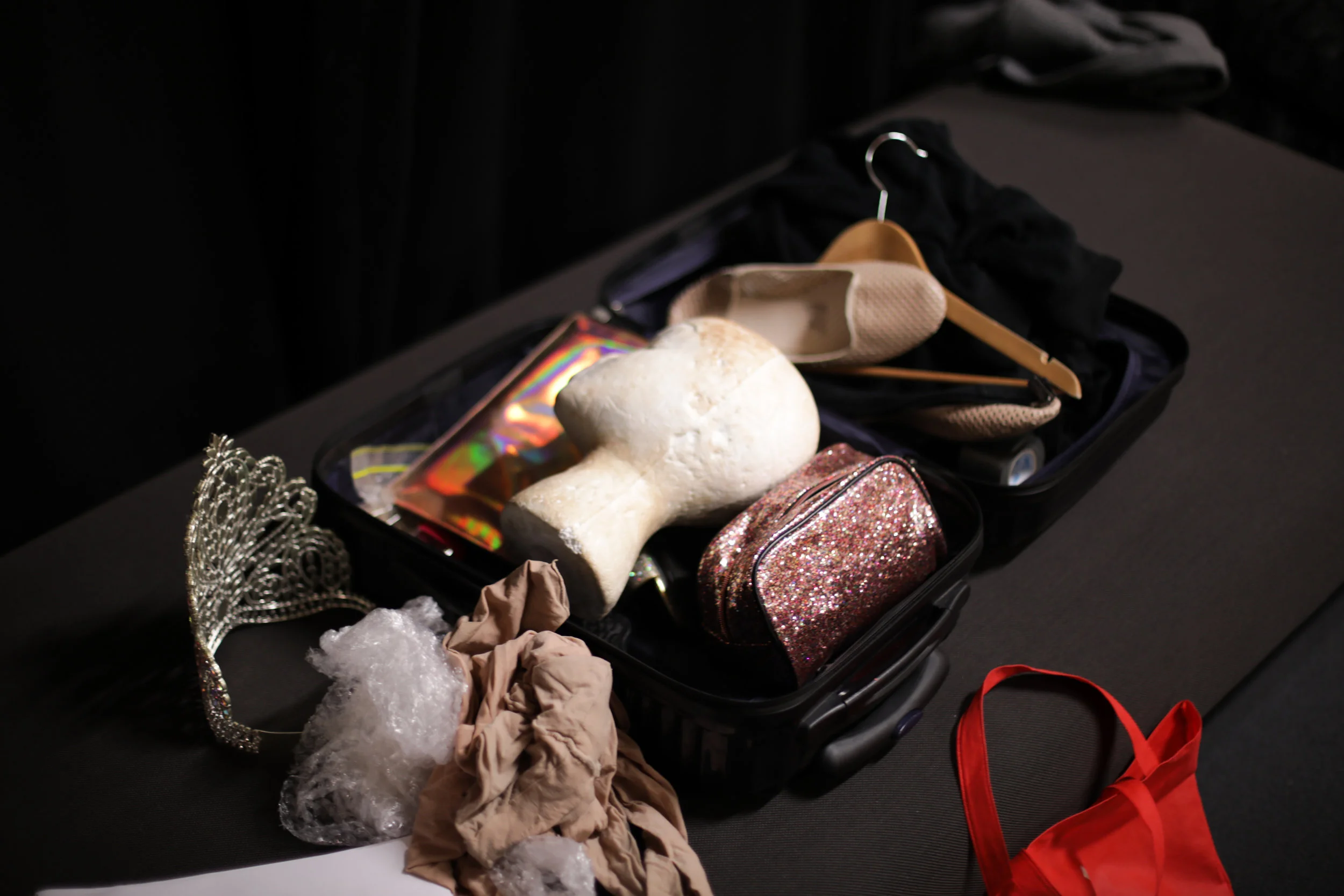 A suitcase lies half packed after the 2019 Miss First Nation. One contestant flew over 3,000km to compete in the pageant's Melbourne debut, and they all left with an award. Photo: Warwick Jones