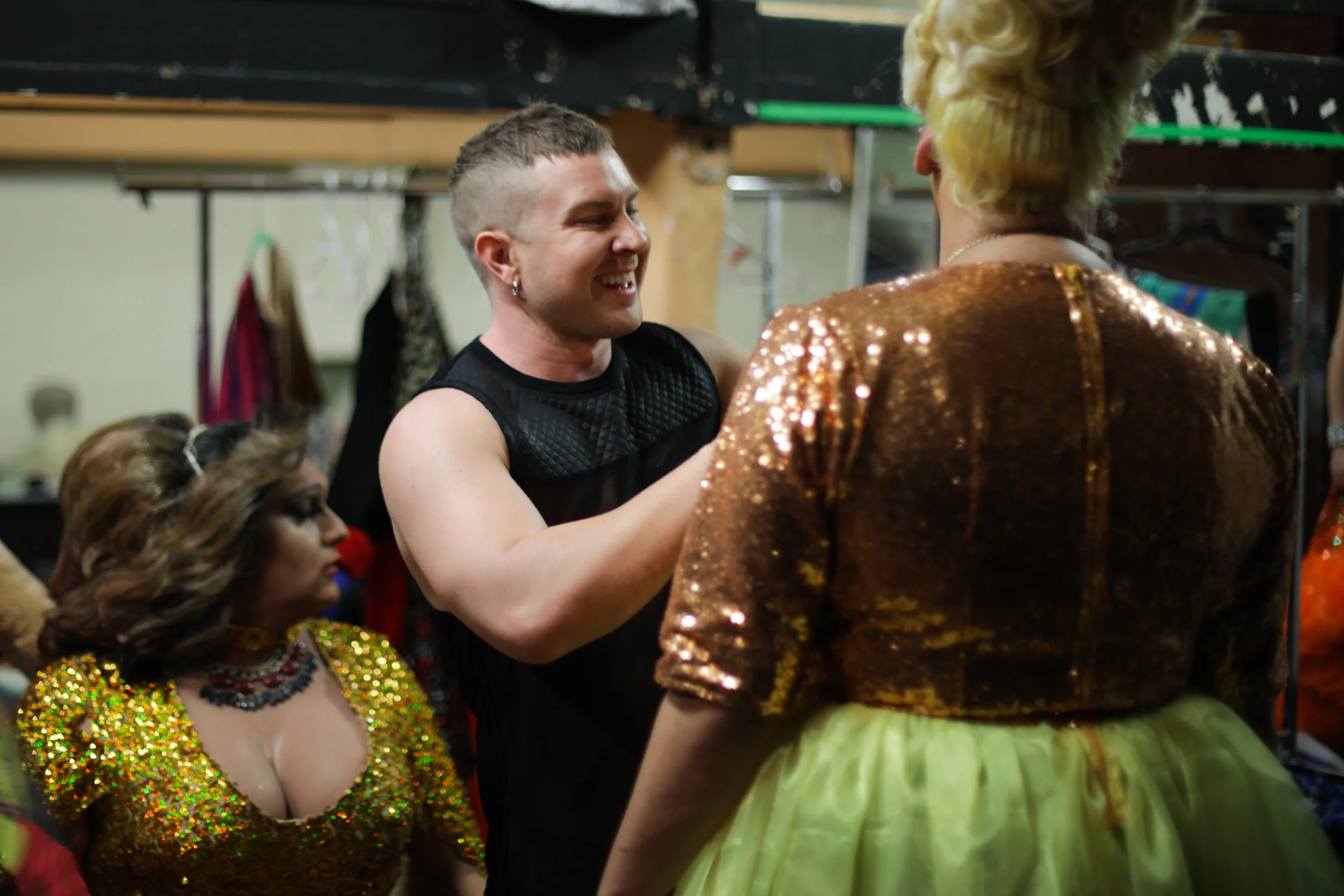 A friend adjusts Chocolate Boxx’s costume. Photo: Warwick Jones