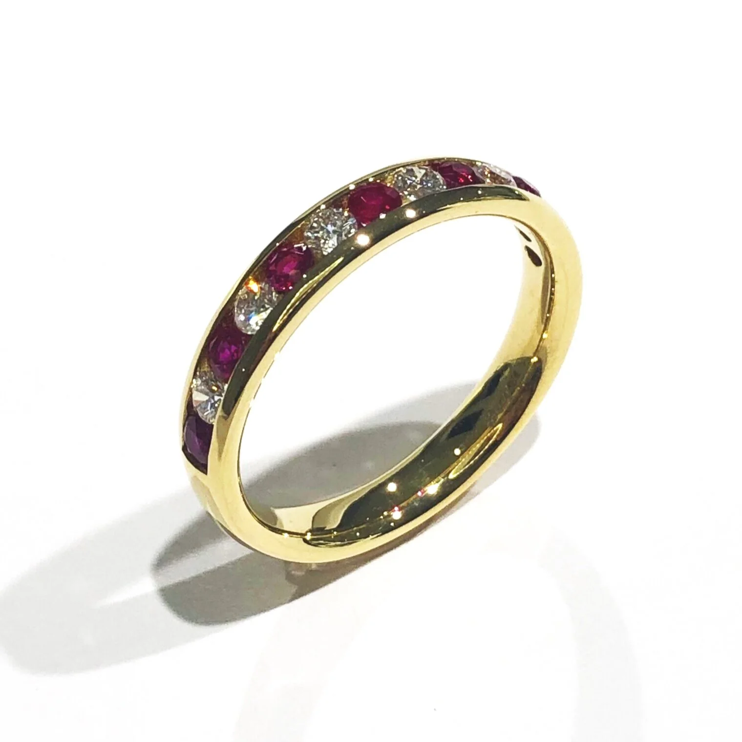 Round Brilliant Cut Diamond and Ruby Eternity Ring