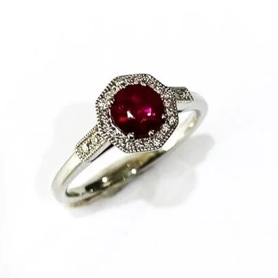 Ruby and Diamond Platinum Ring with Milgrain Detailing.